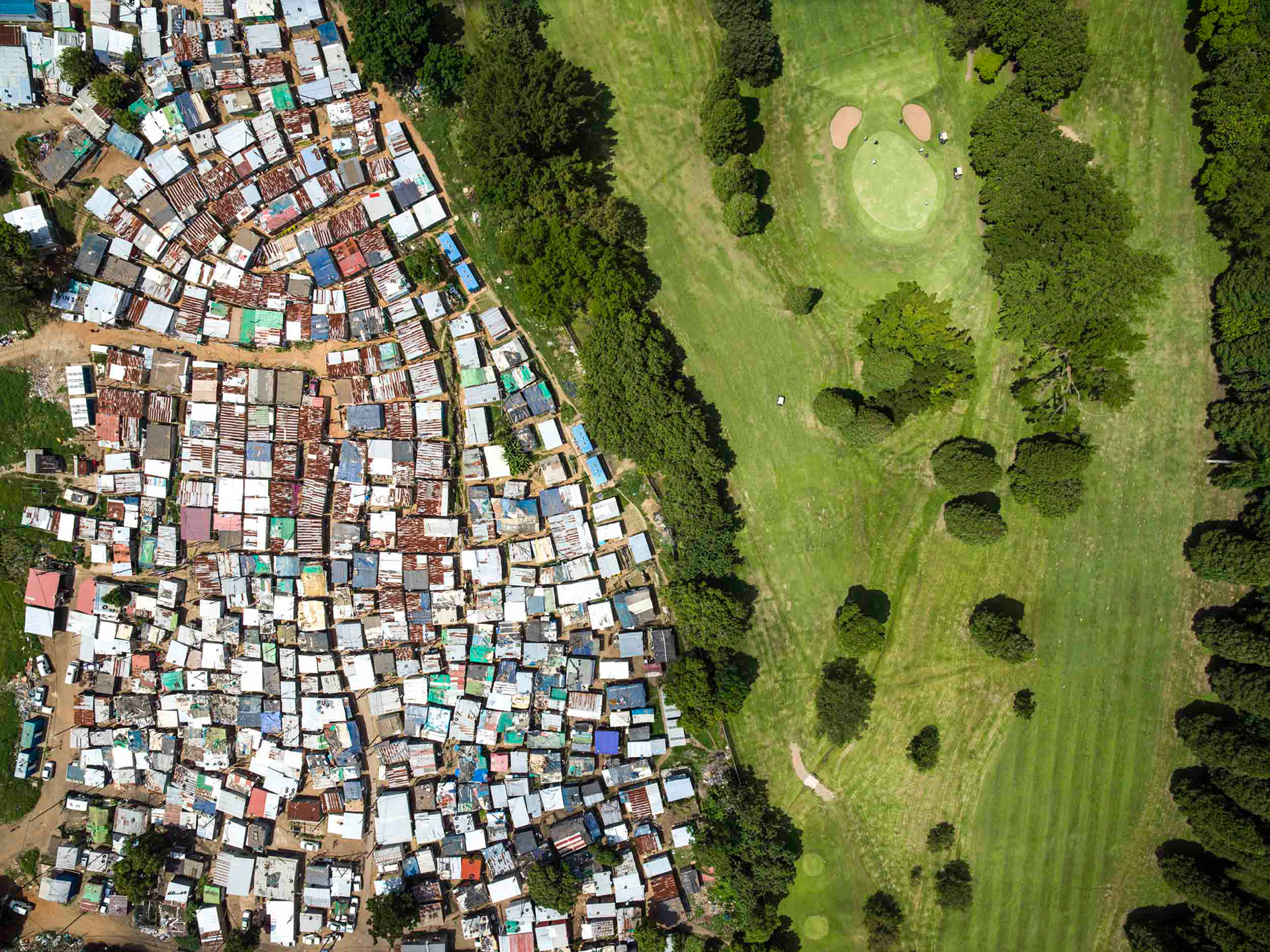 golf course with a slum in durban south africa