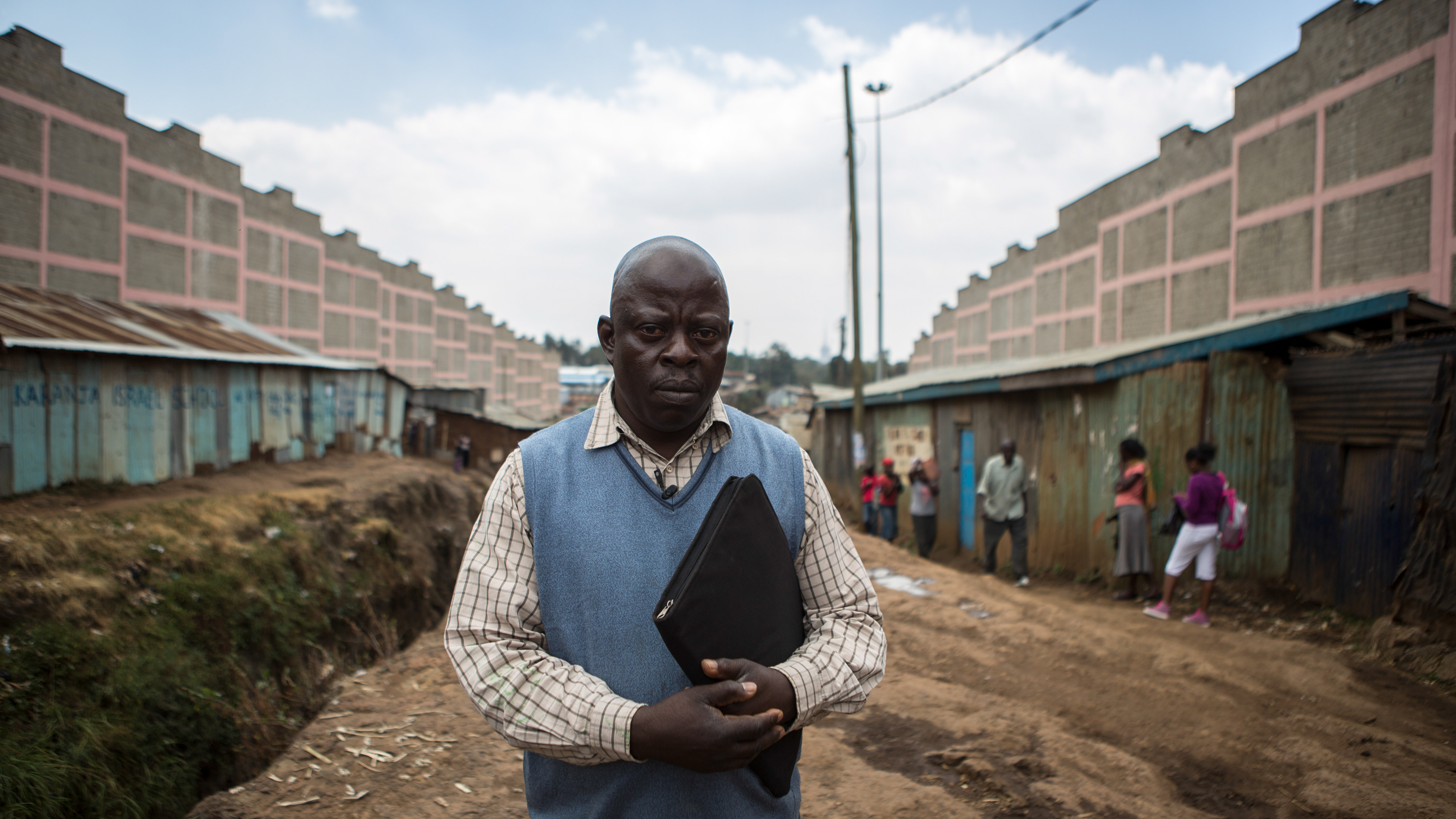 man with blue vest in nairobi