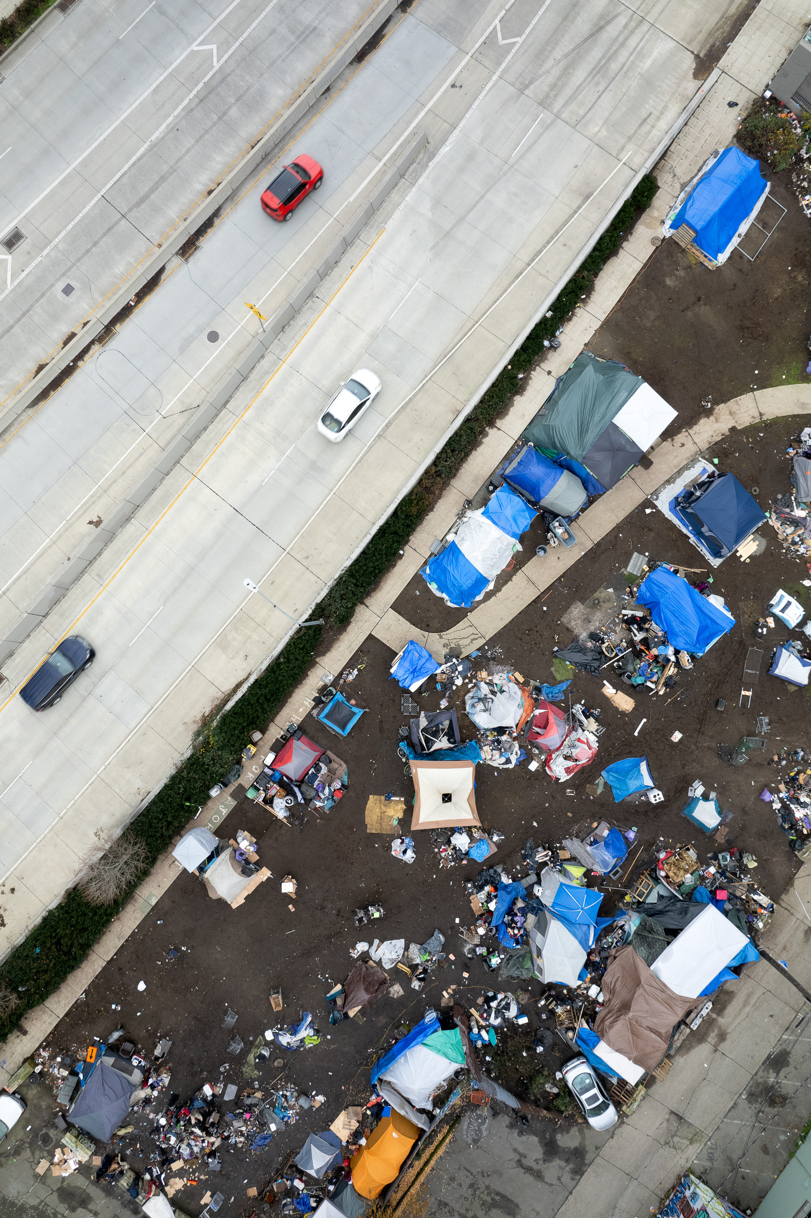 an aerial view of a homeless tent city next to the space needle in seattle