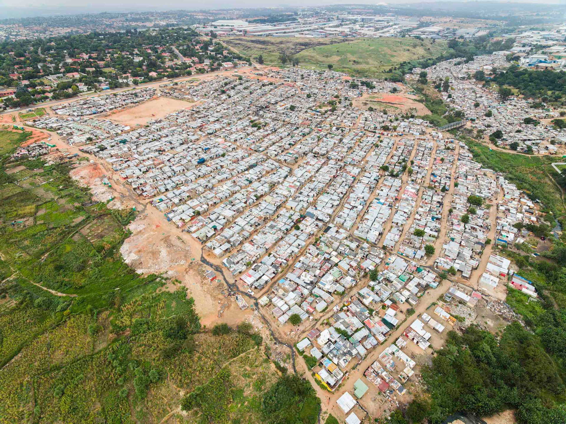 aerial image of slums and wealthy homes in johannesburg