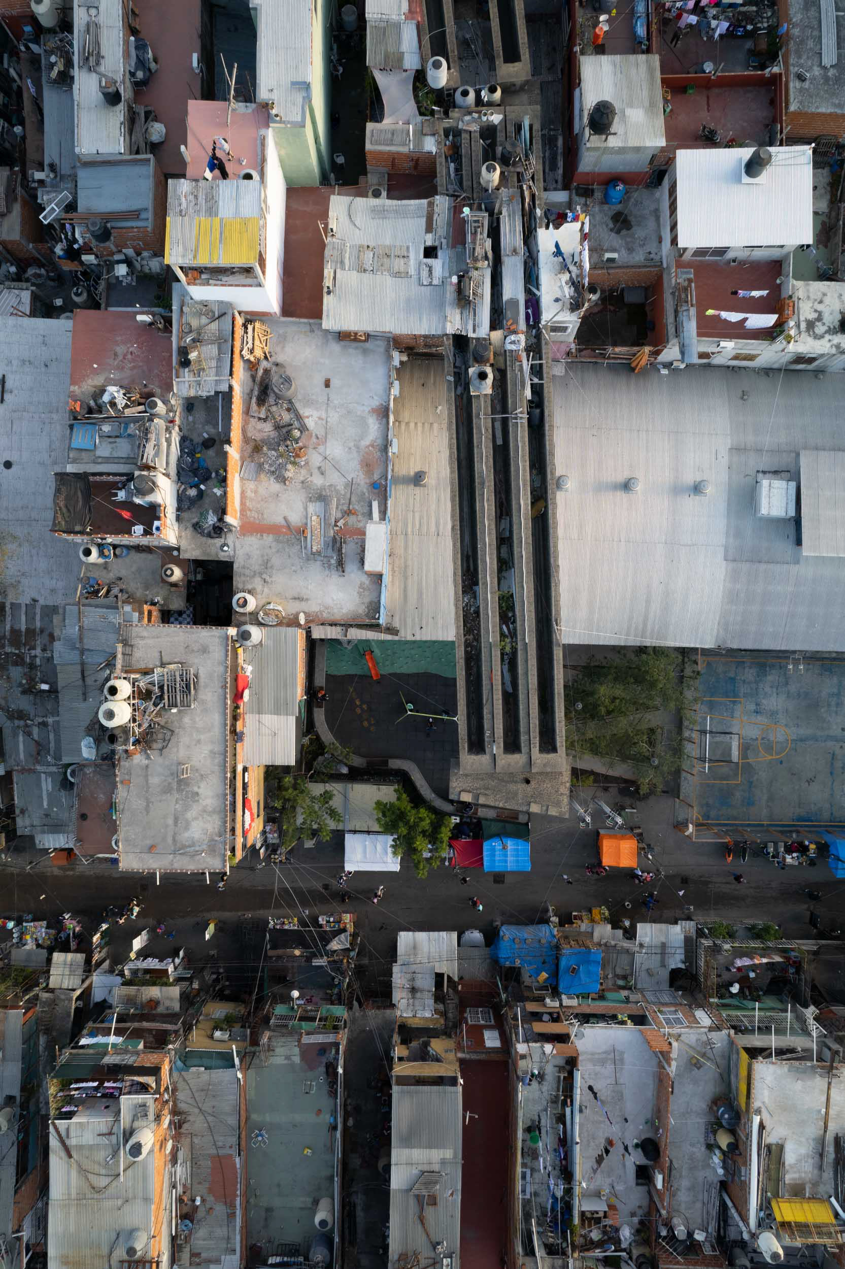A drone photo of an unfinished highway over houses.