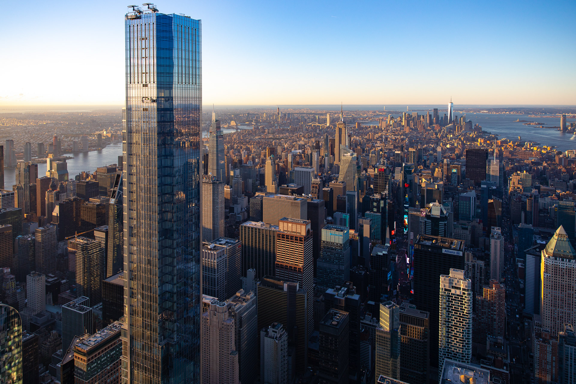Midtown manhattan in New York City with skyscrapers and blue sky.