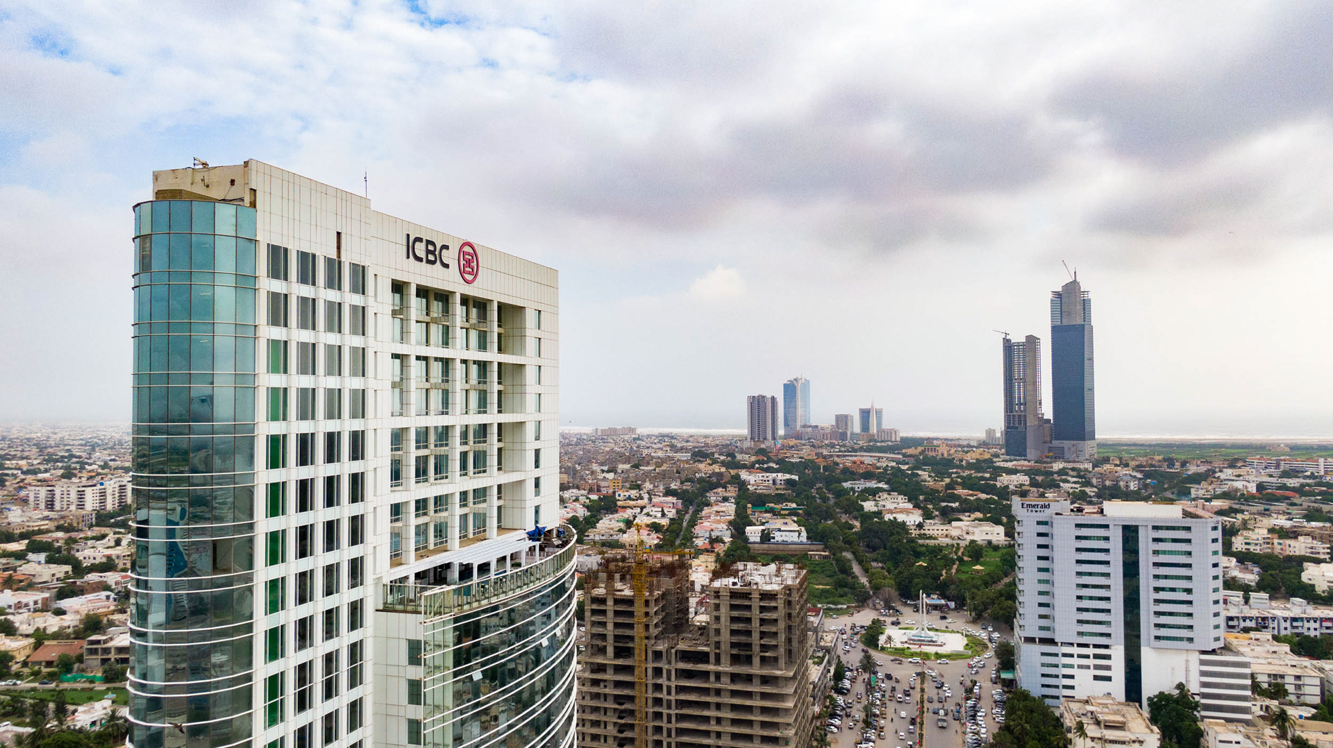 A drone view of a bank with other skyscrapers on the horizon.