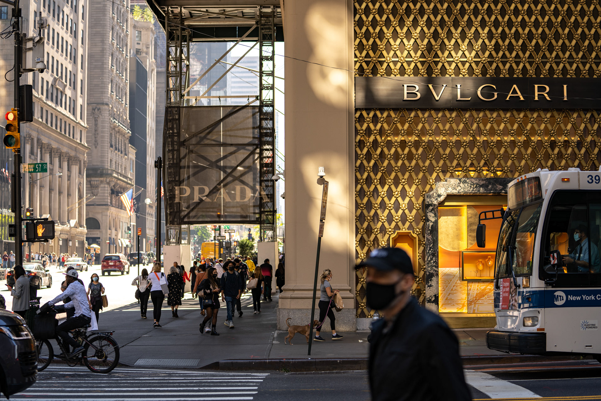 A Bvlgari store colored gold in the afternoon light street scene, New York.