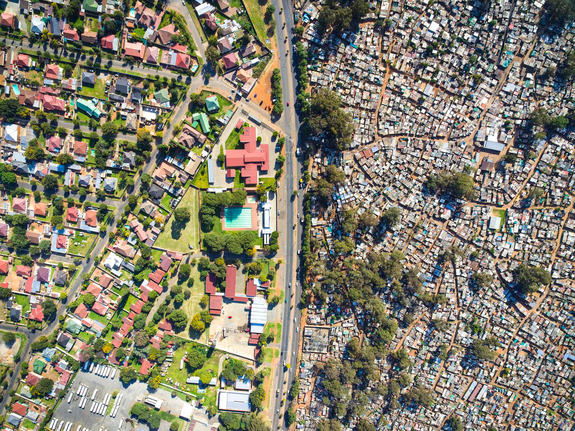Shacks and slums next to wealthy homes in Johannesburg South Africa
