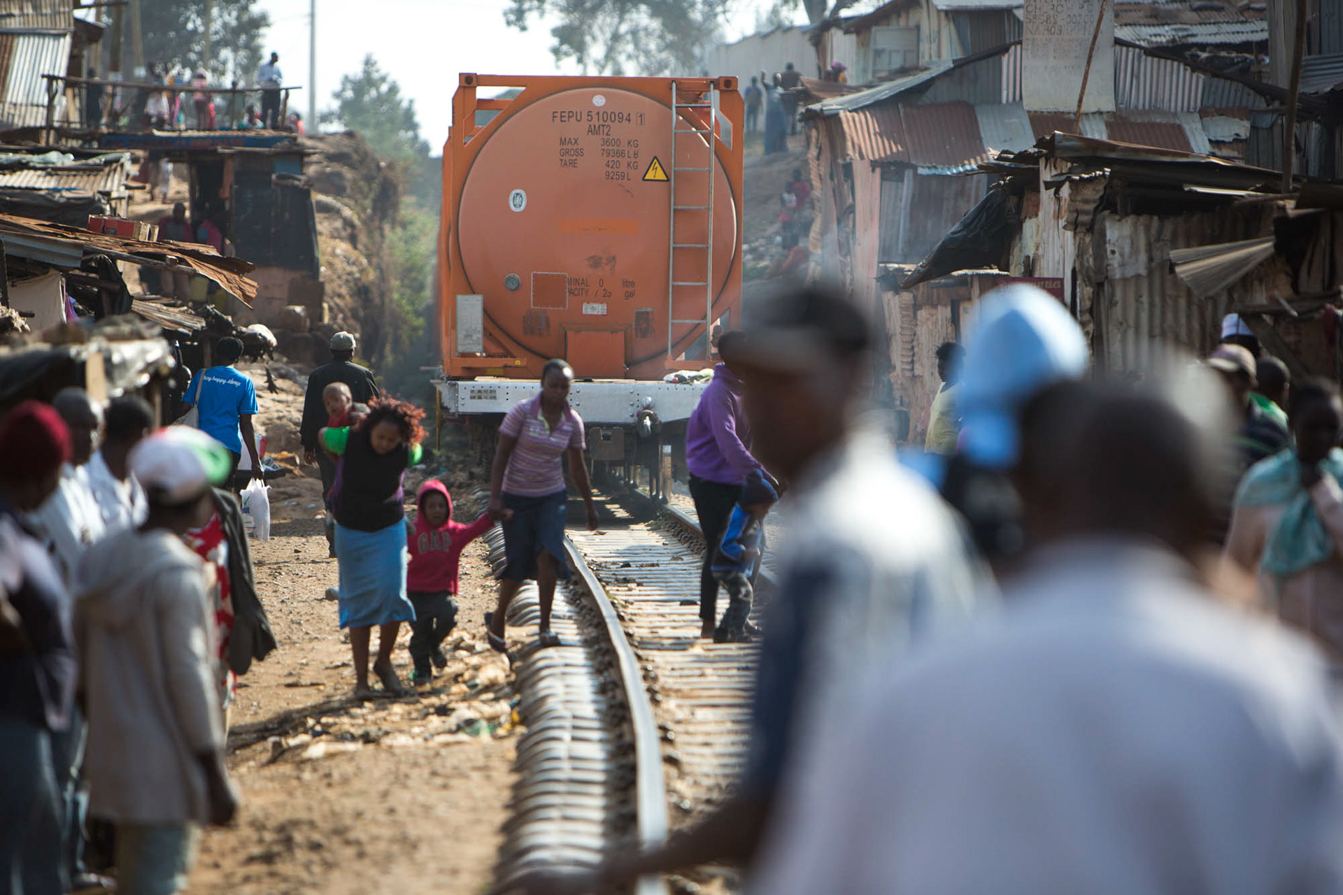 people cross train tracks