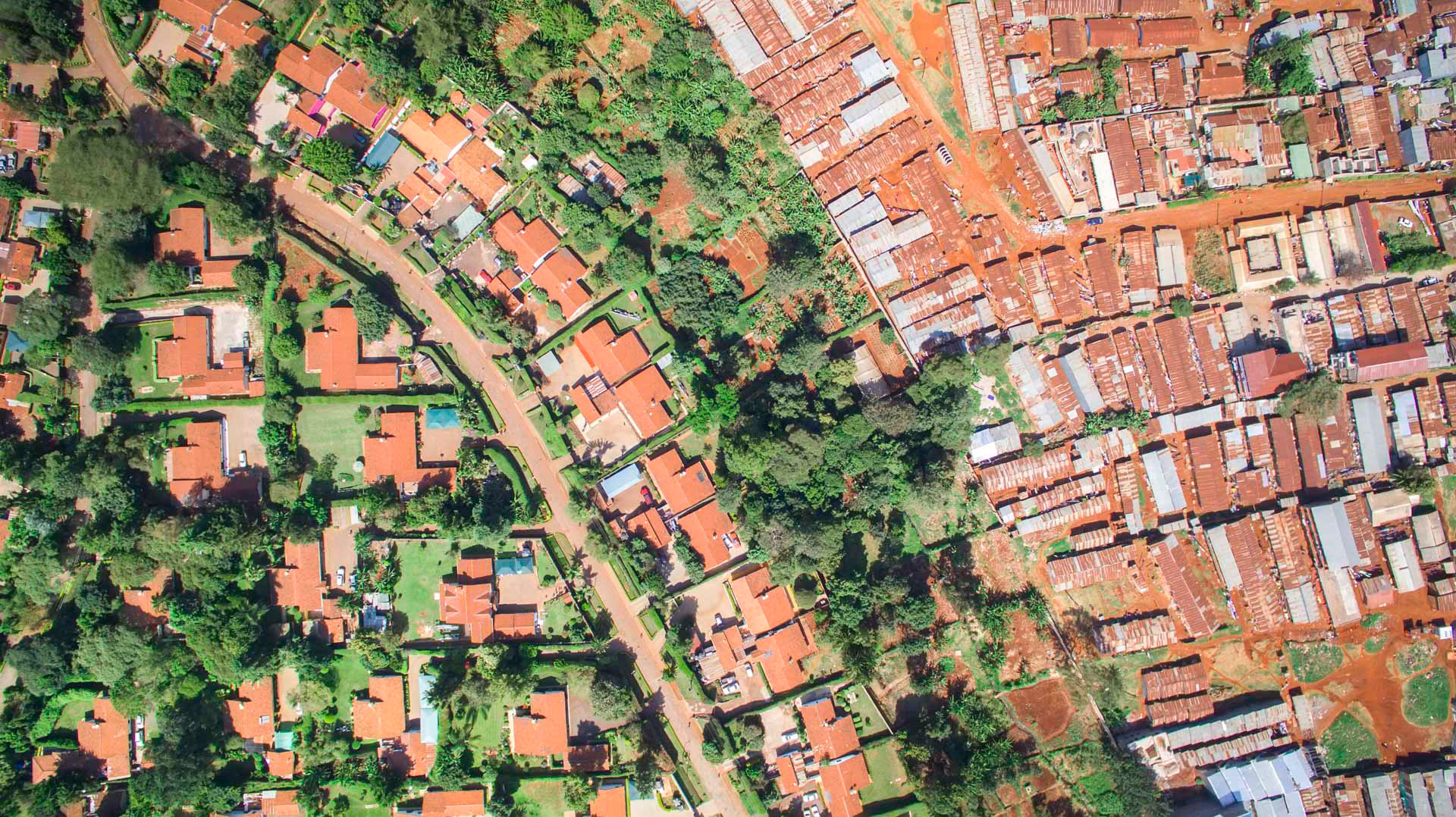 orange houses with green yards and orange slums in nairobi