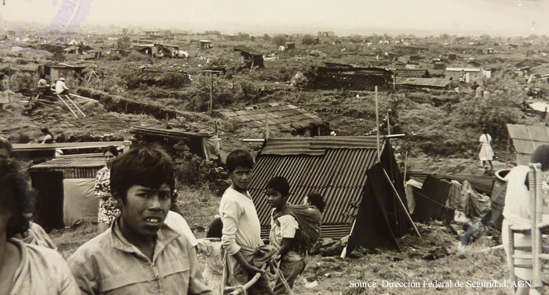 historical image of workers being moved from houses in mexico city