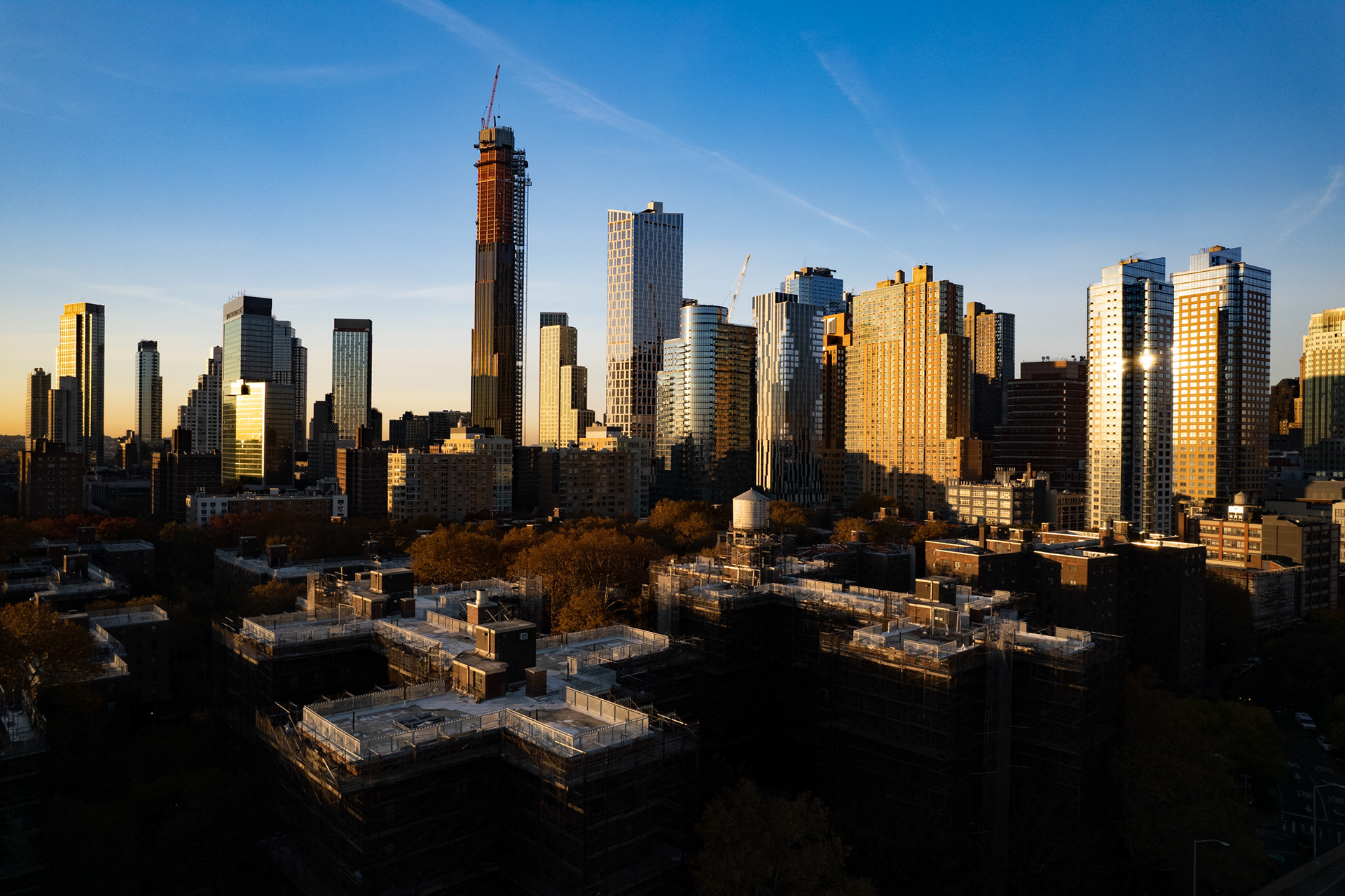 Skyscrapers on the horizon with a blue sky.