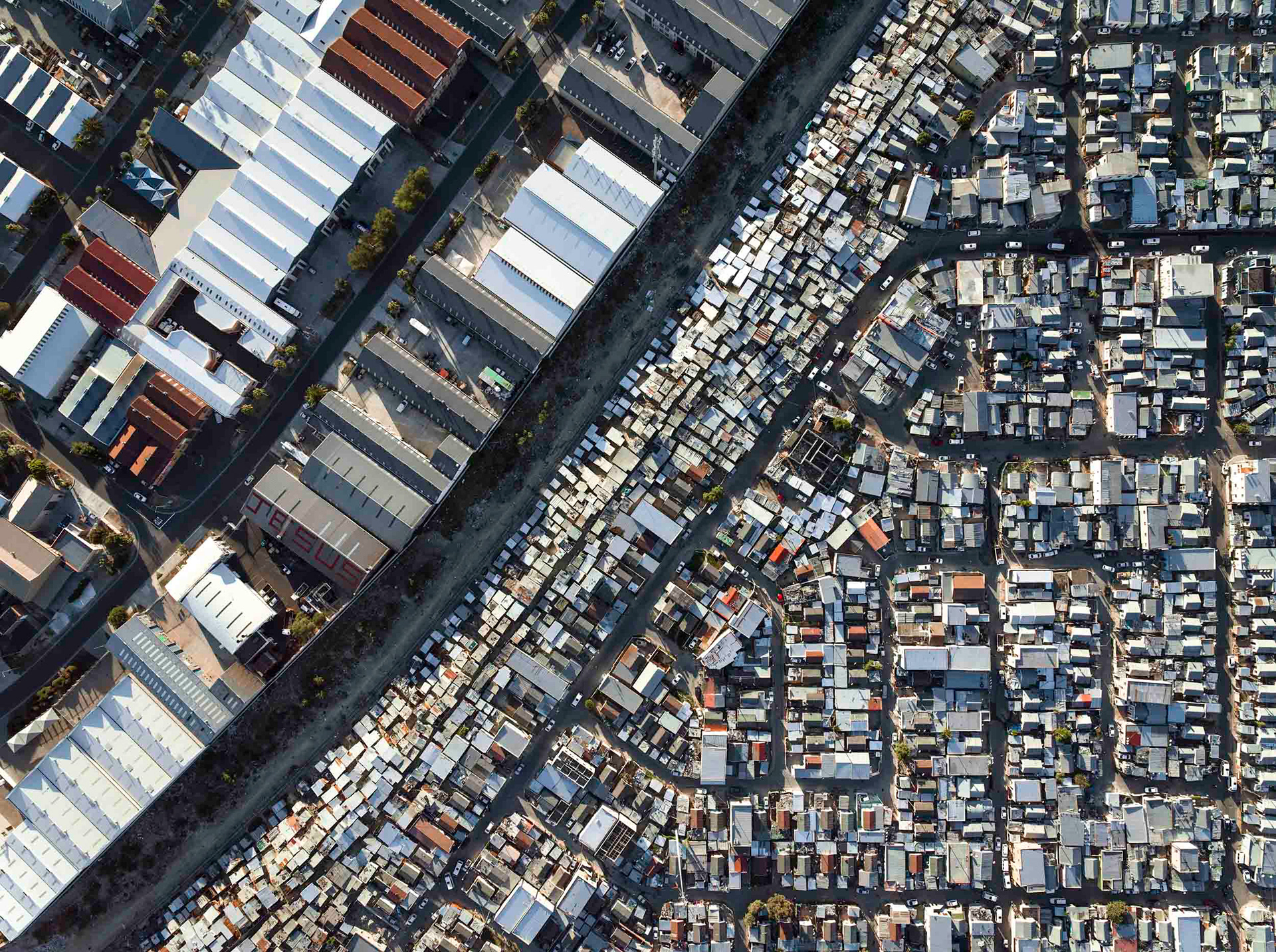 shacks next to a railroad track in cape town south africa