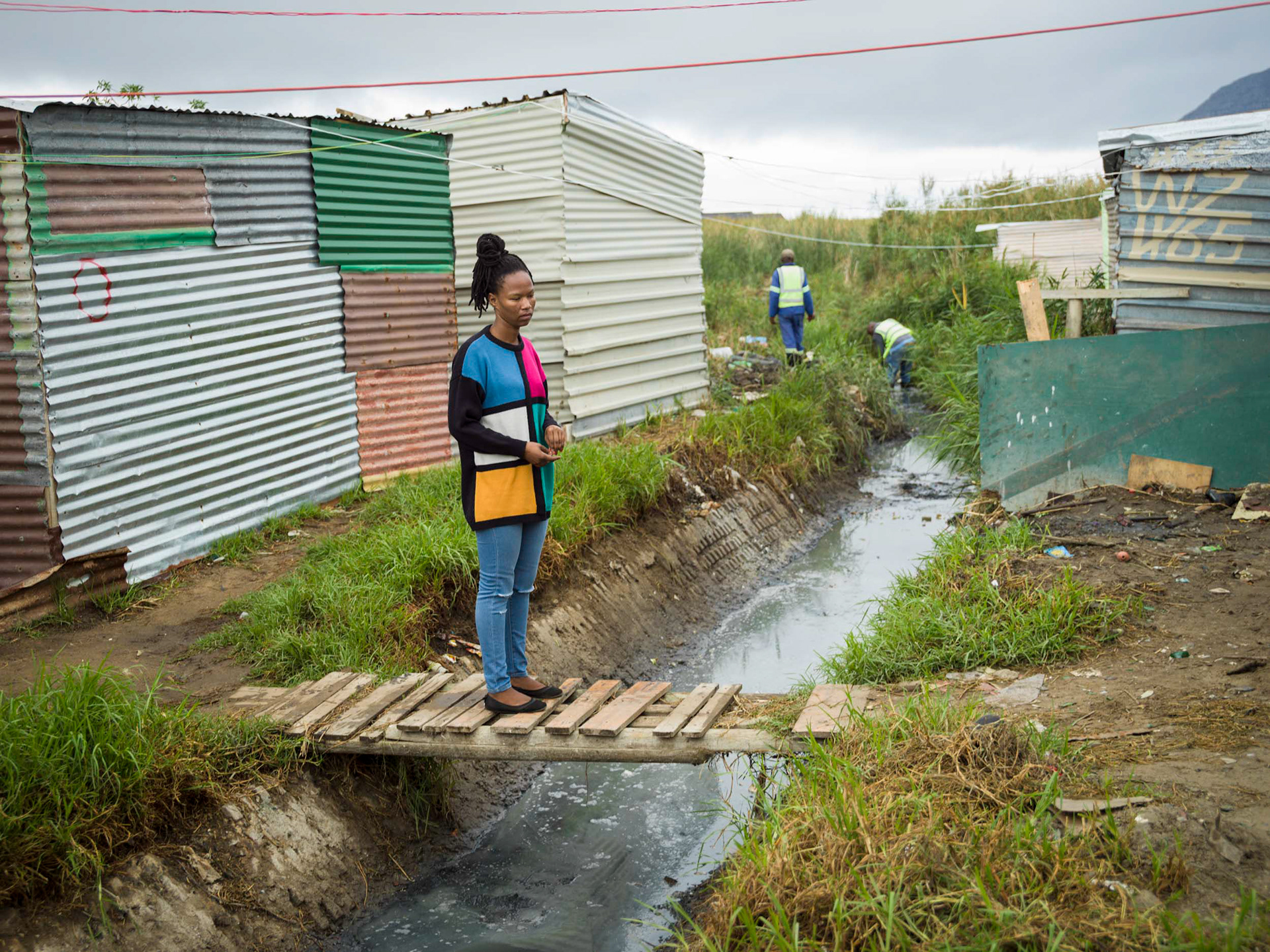 A forlorn woman in a slum in cape town south africa