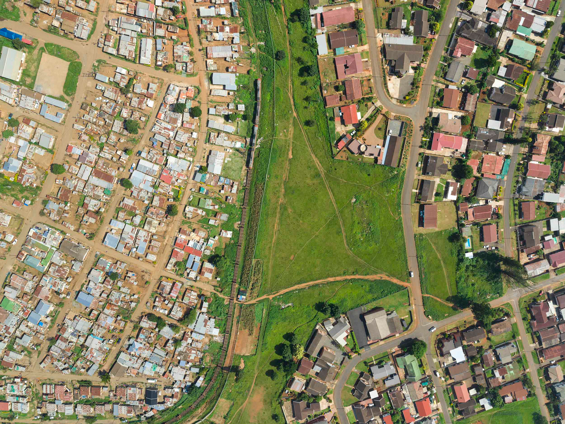 aerial view of shacks and train in pietermaritzburg