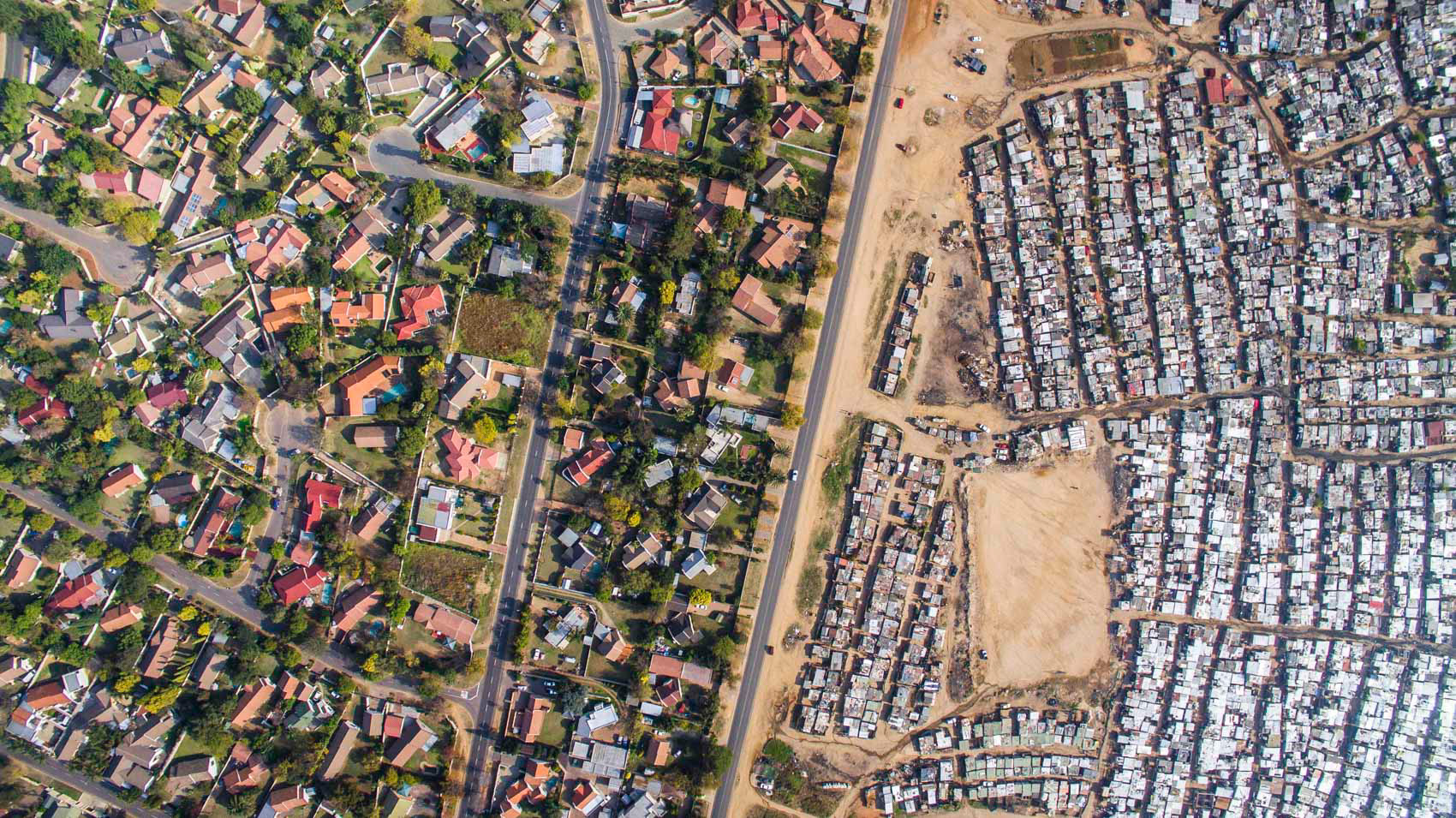 aerial image of slums and wealthy homes in johannesburg