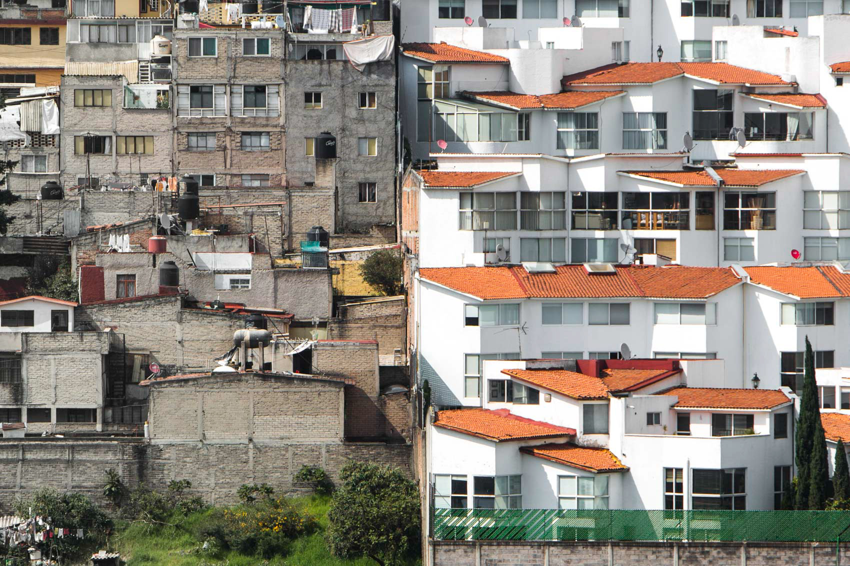 new homes side by side with slums in mexico city