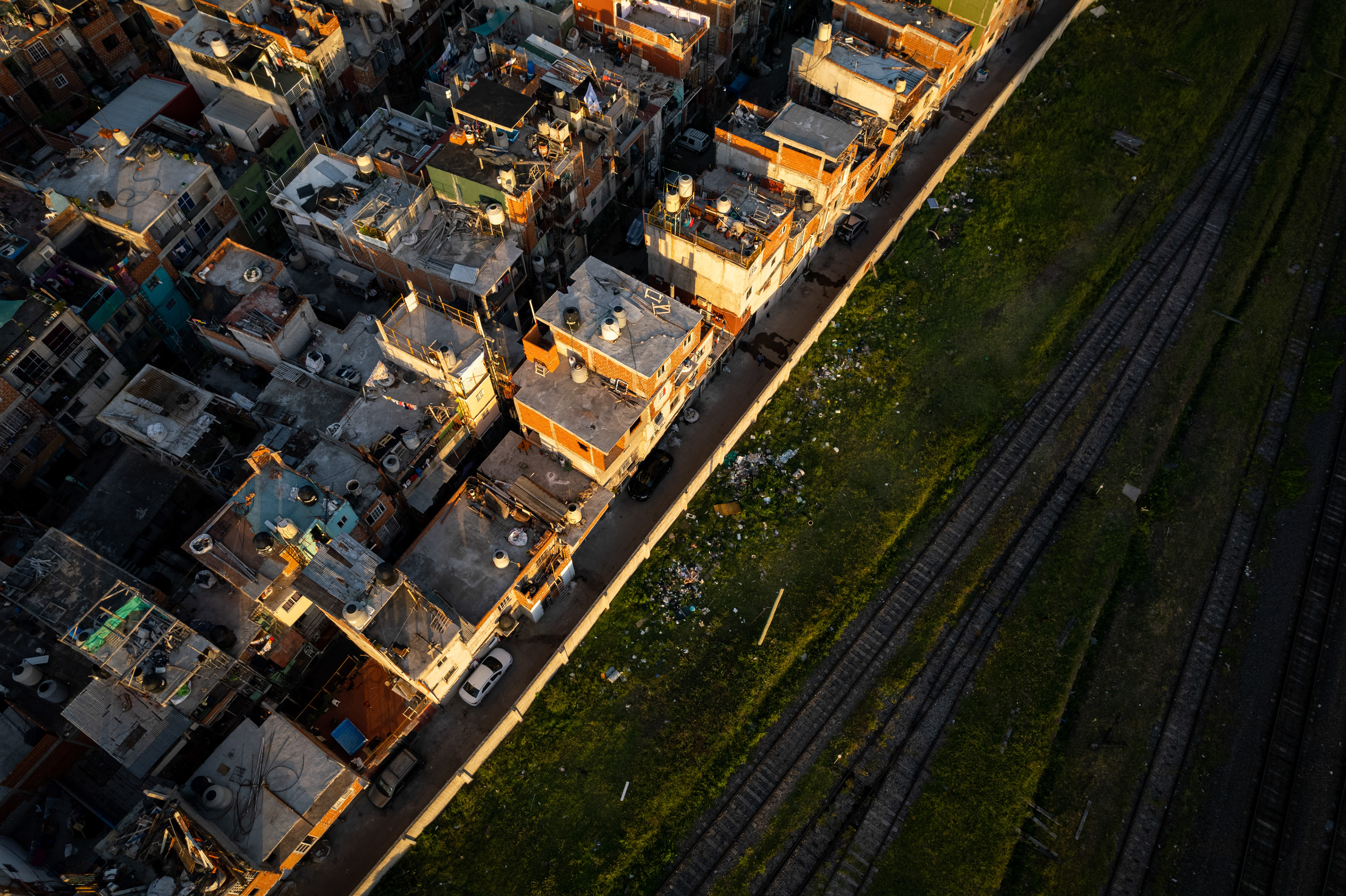Slum homes next to train tracks in Buenos Aires, Argentina.