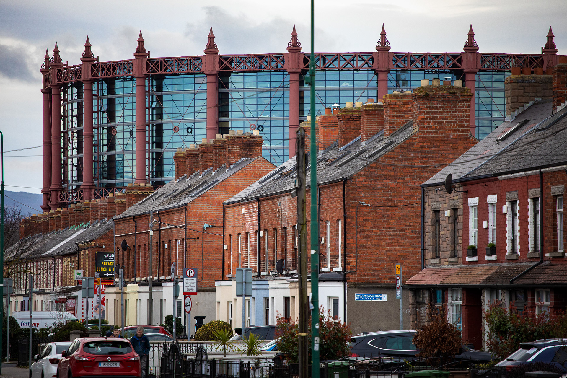 Old homes in front of a new apartment building in Dublin, Ireland