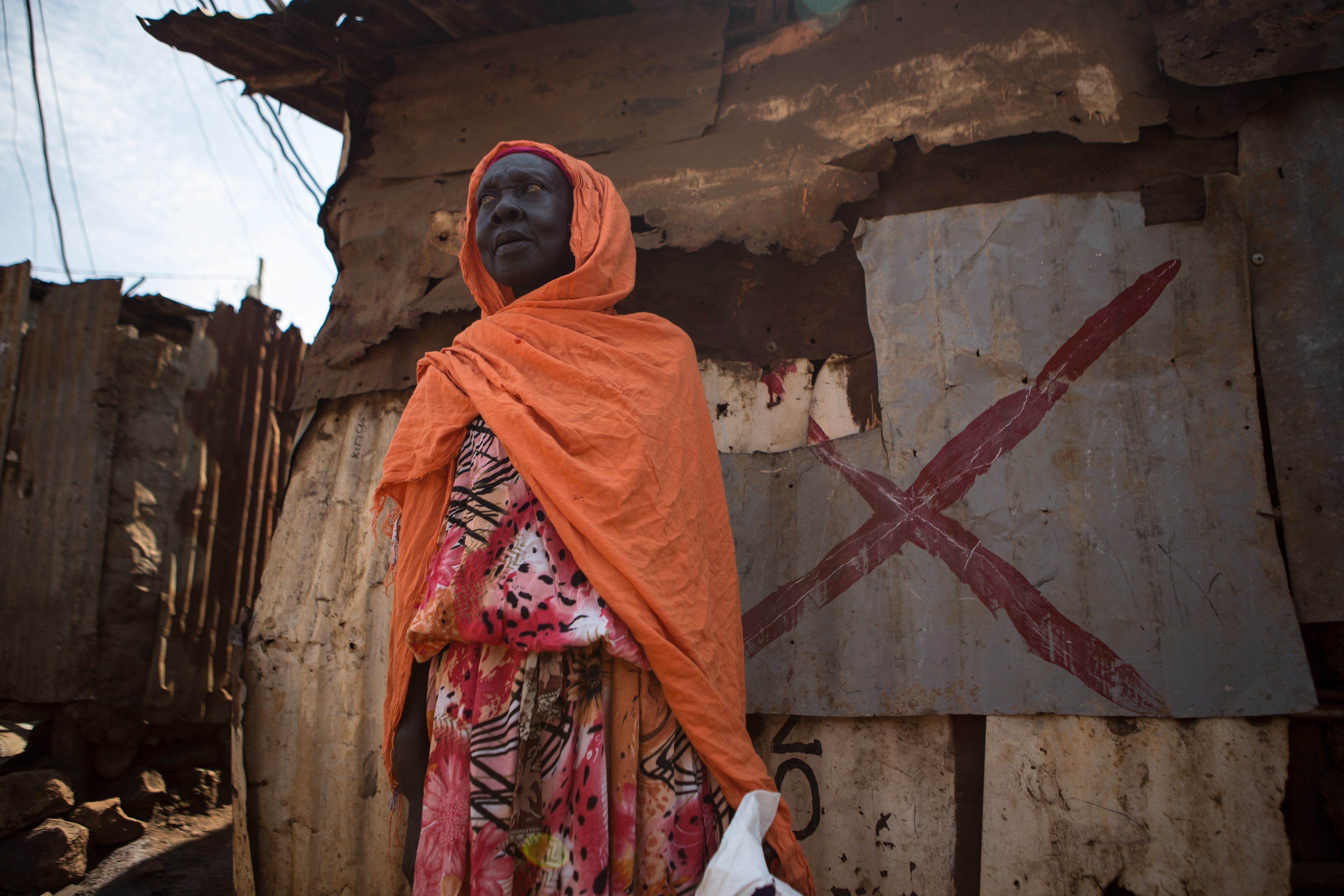 elderly woman in orange in nairobi
