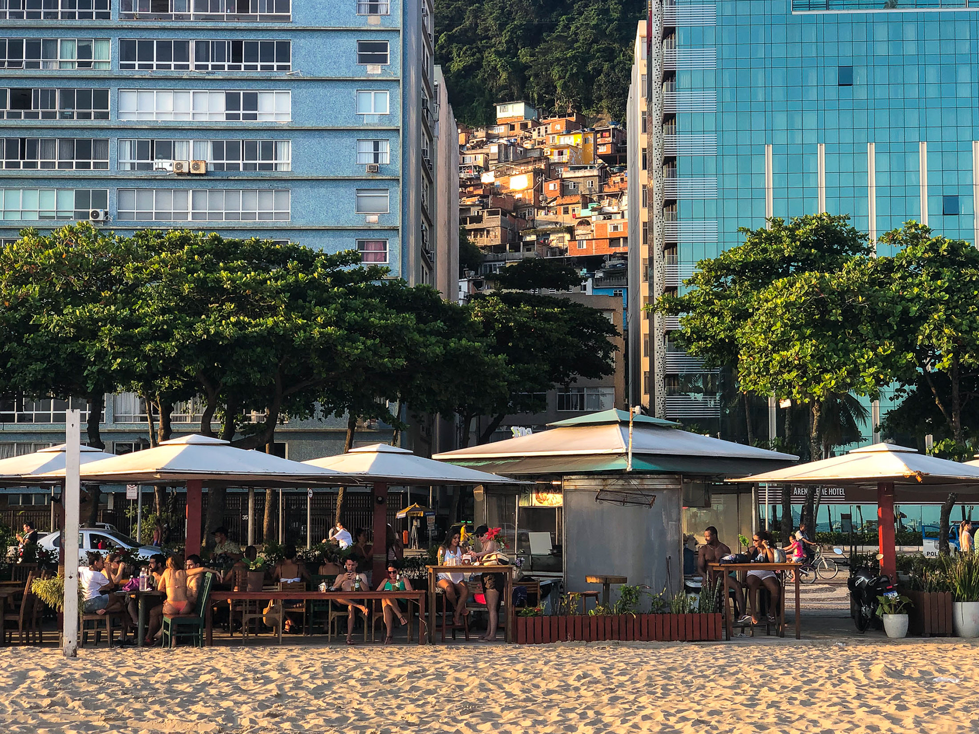 Two hotels sandwich a favela in Copacabana beach.