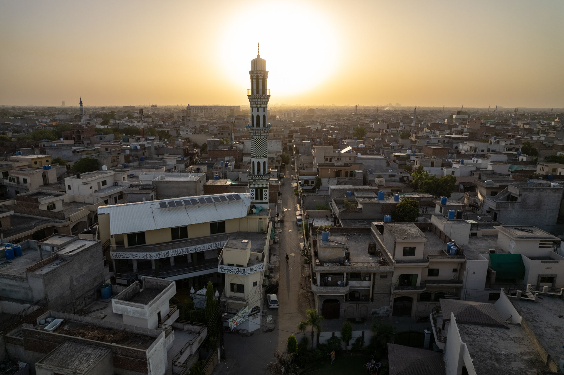 A drone view of a mosque at sunset.