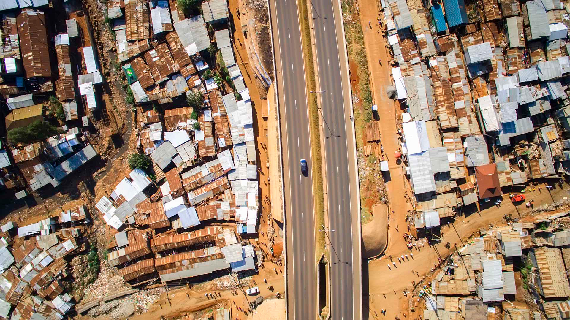 highway cutting through a slum in nairobi