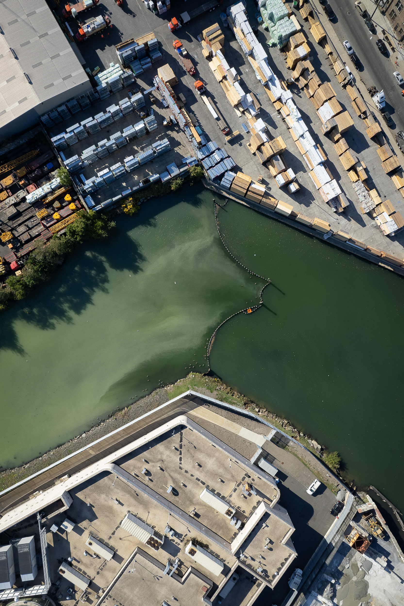 A drone photo of a river with pollution.