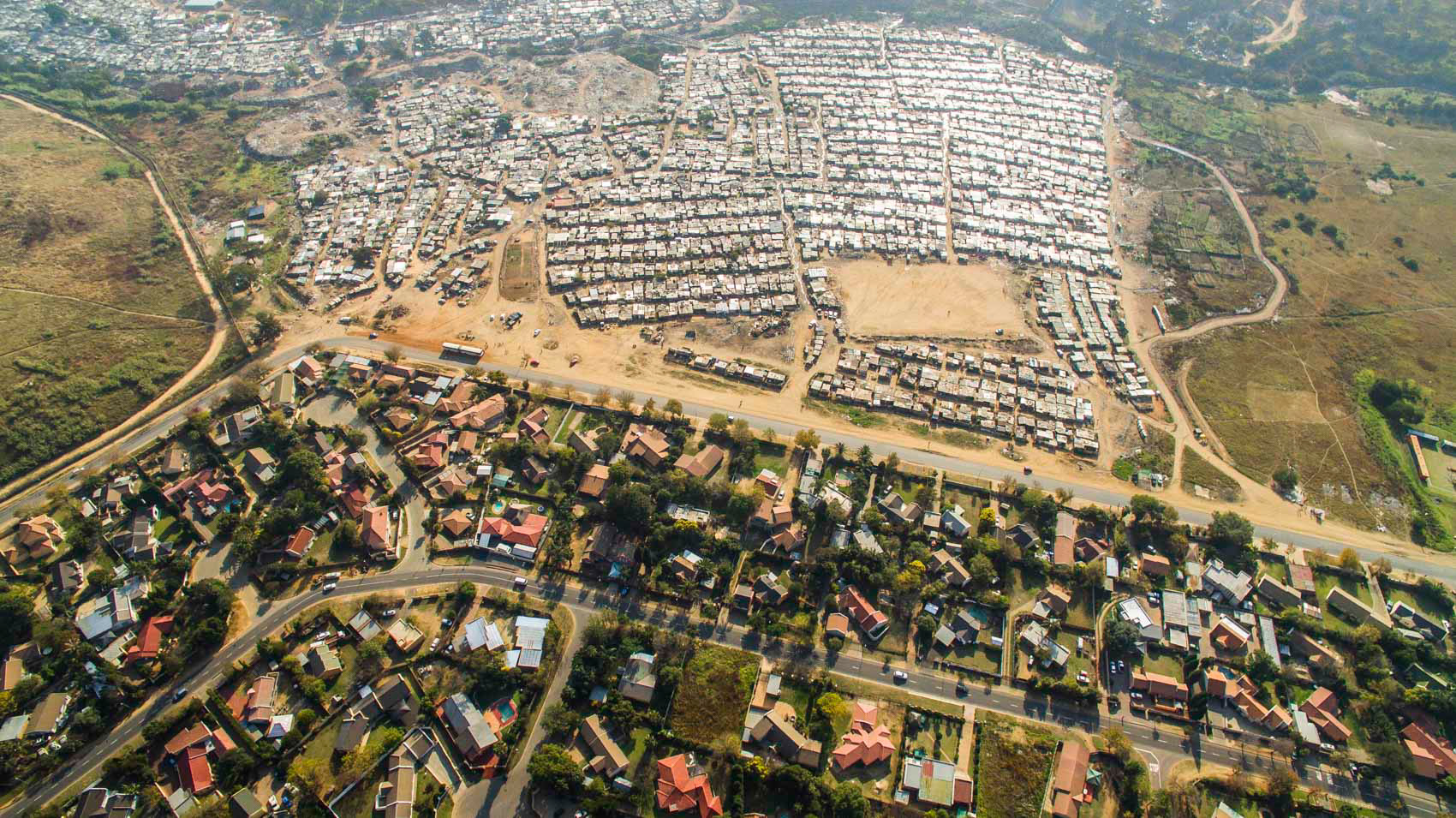 aerial image of slums and wealthy homes in johannesburg