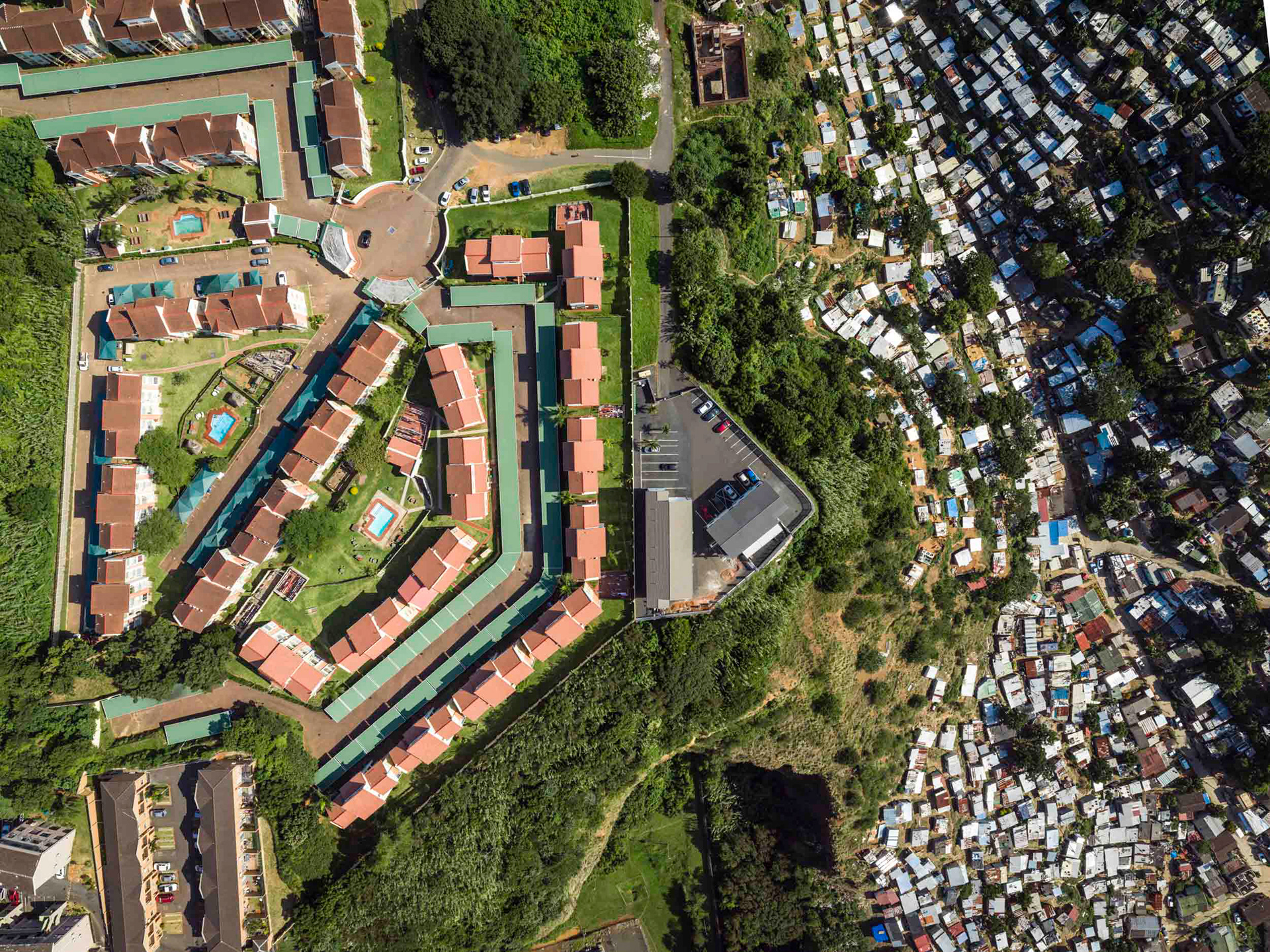 aerial view of shacks and apartment buildings in durban