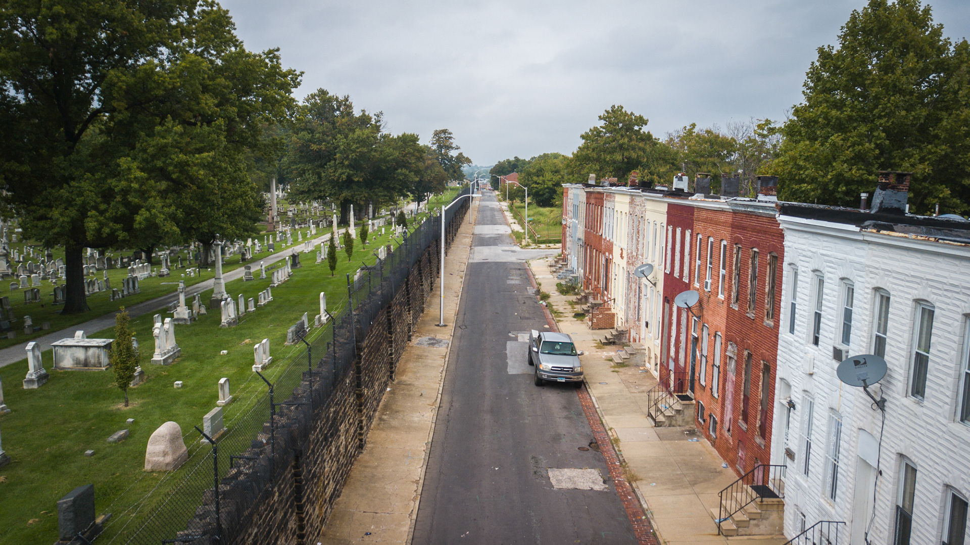 Abandoned row homes next to a cemetery in East Baltimore.