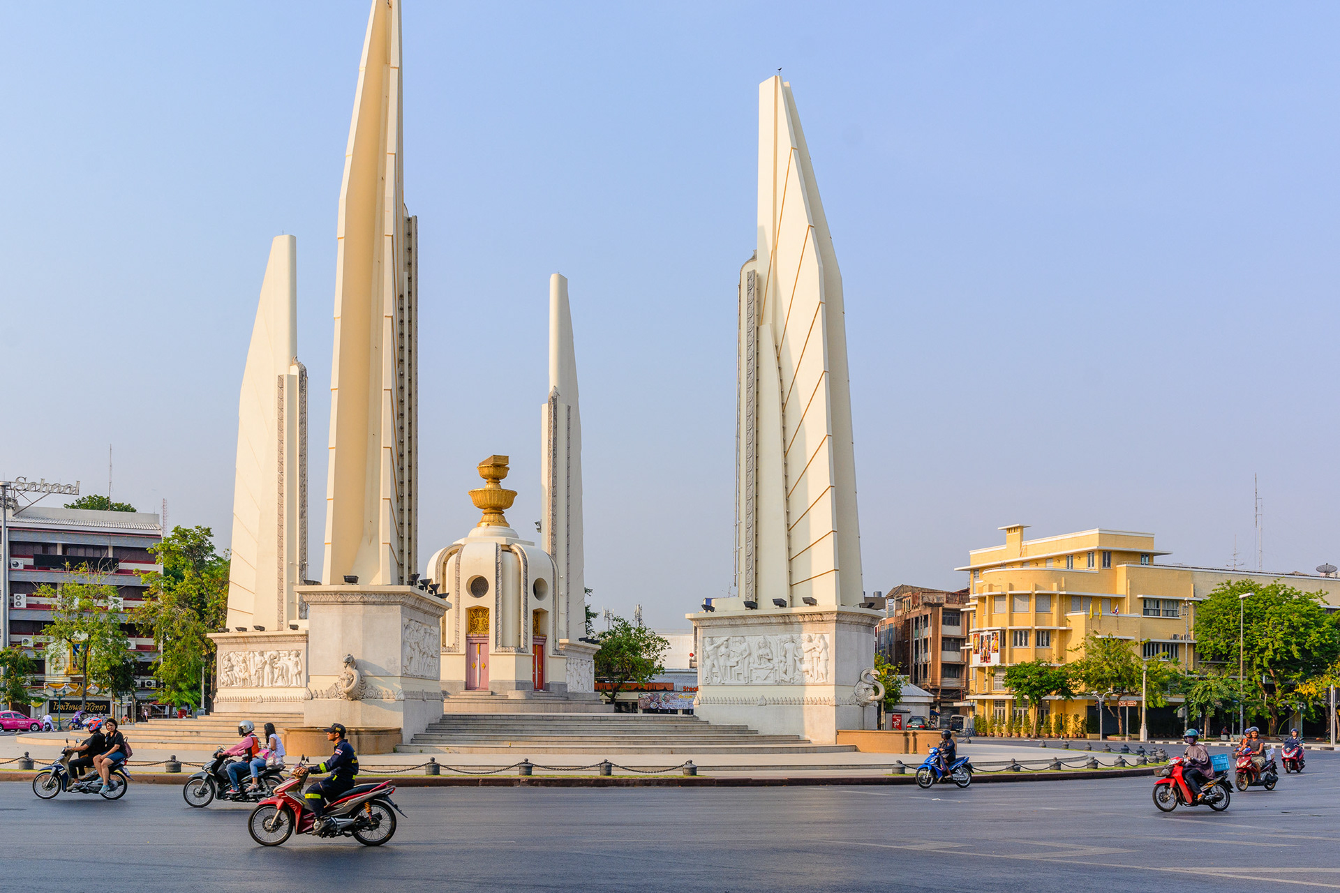 Scooters circling the Democracy Monument in Bangkok Thailand