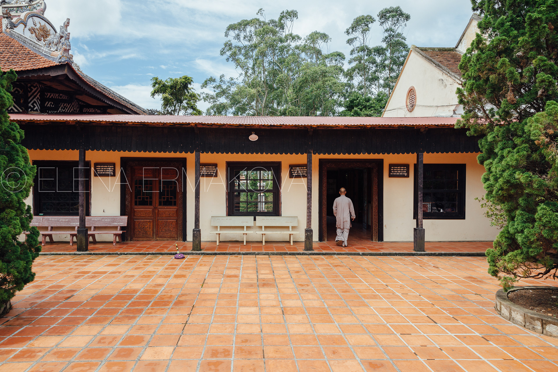A monk walks on the grounds of the Linh Son Pagoda, Dalat, Vietnam