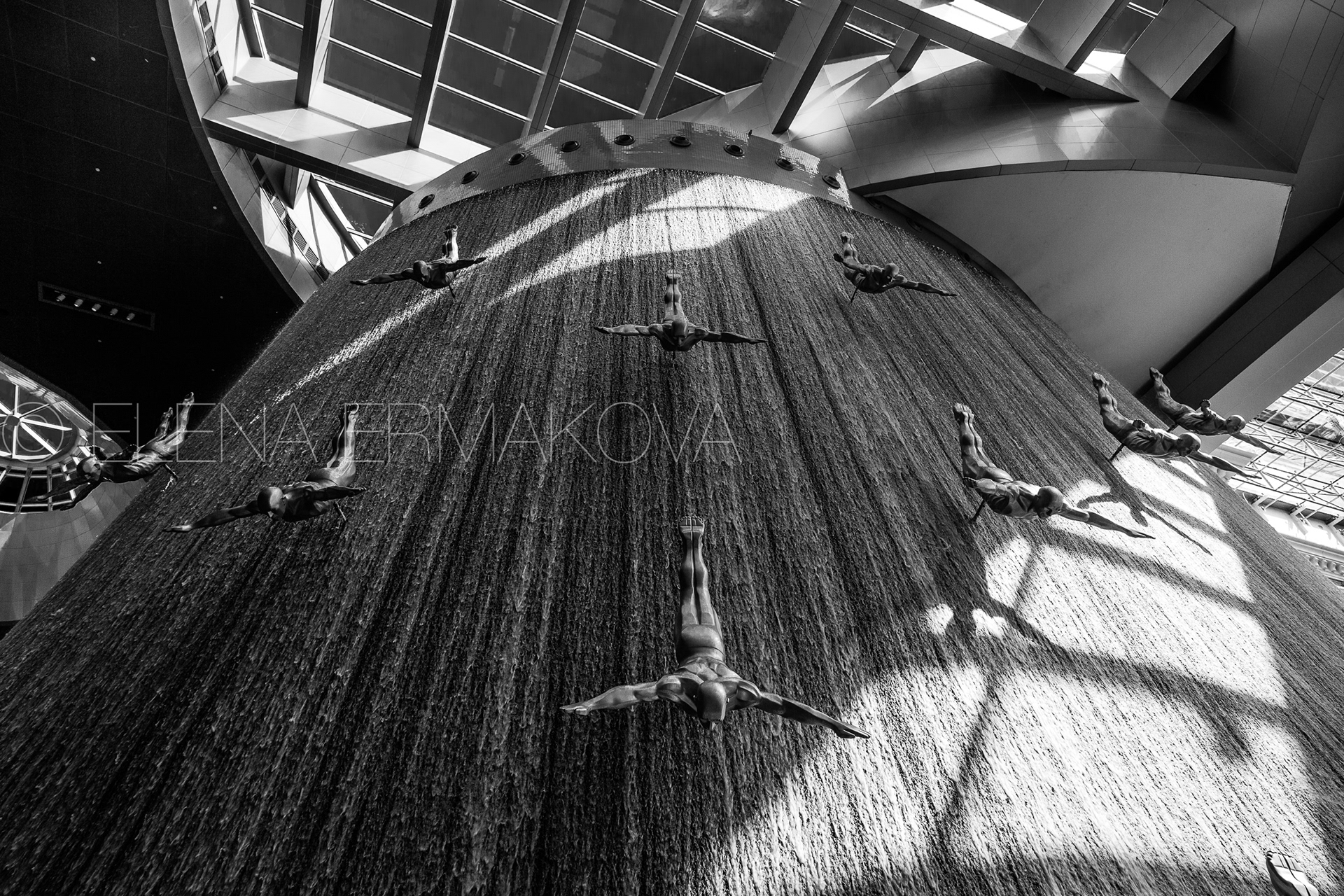 Dubai, UAE - January 25, 2020: Black and white high contrast picture of the waterfall inside the Dubai Mall 