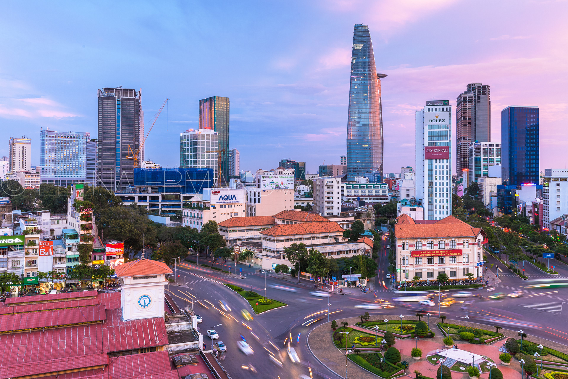 Ho Chi Minh City skyline at sunset with Bitexco Financial Tower on the background, Ben Thanh Market area, District 1, Vietnam