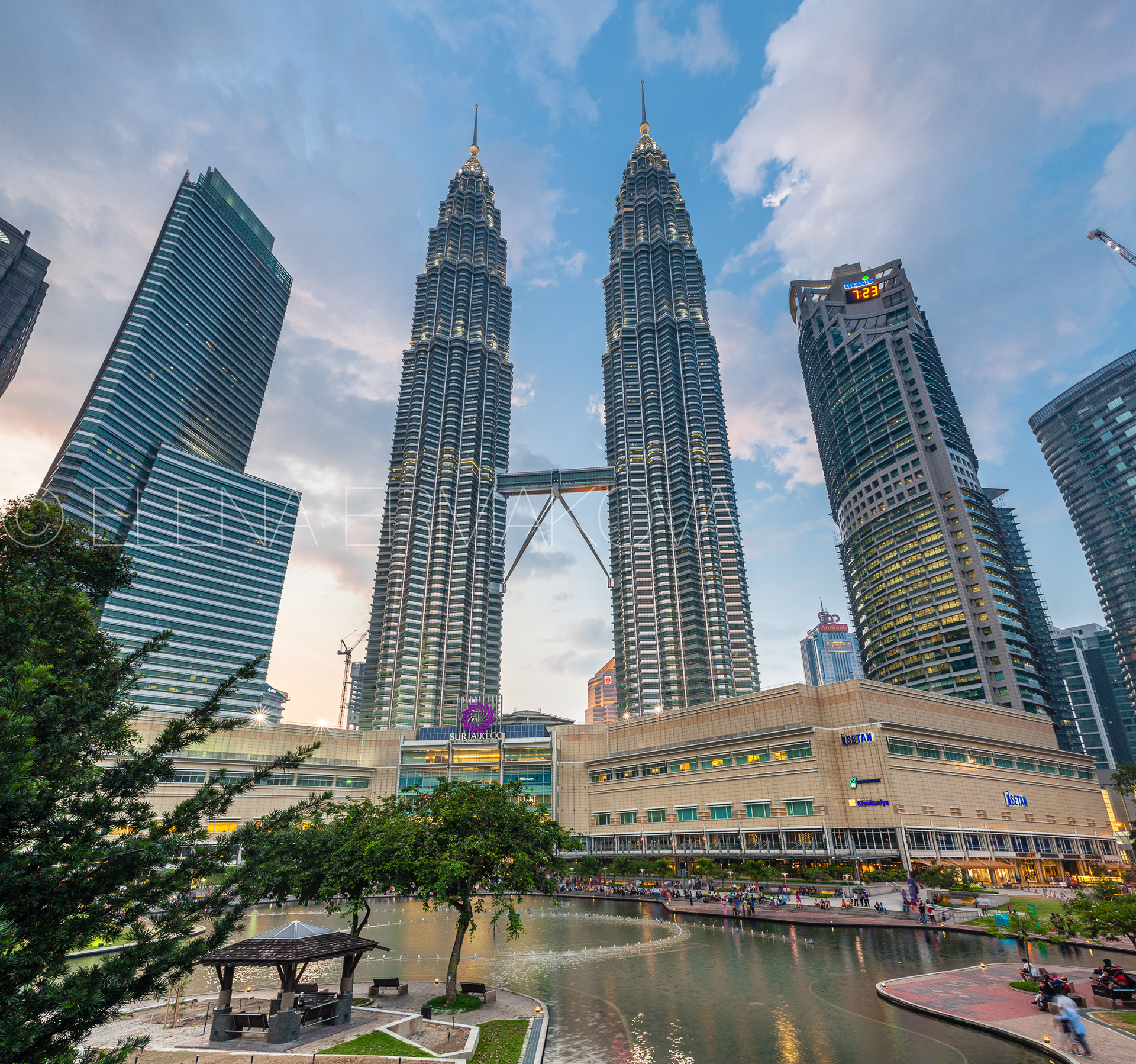 Petronas TwinTowers and Suria KLCC shopping mall at sunset, Kuala Lumpur, Malaysia