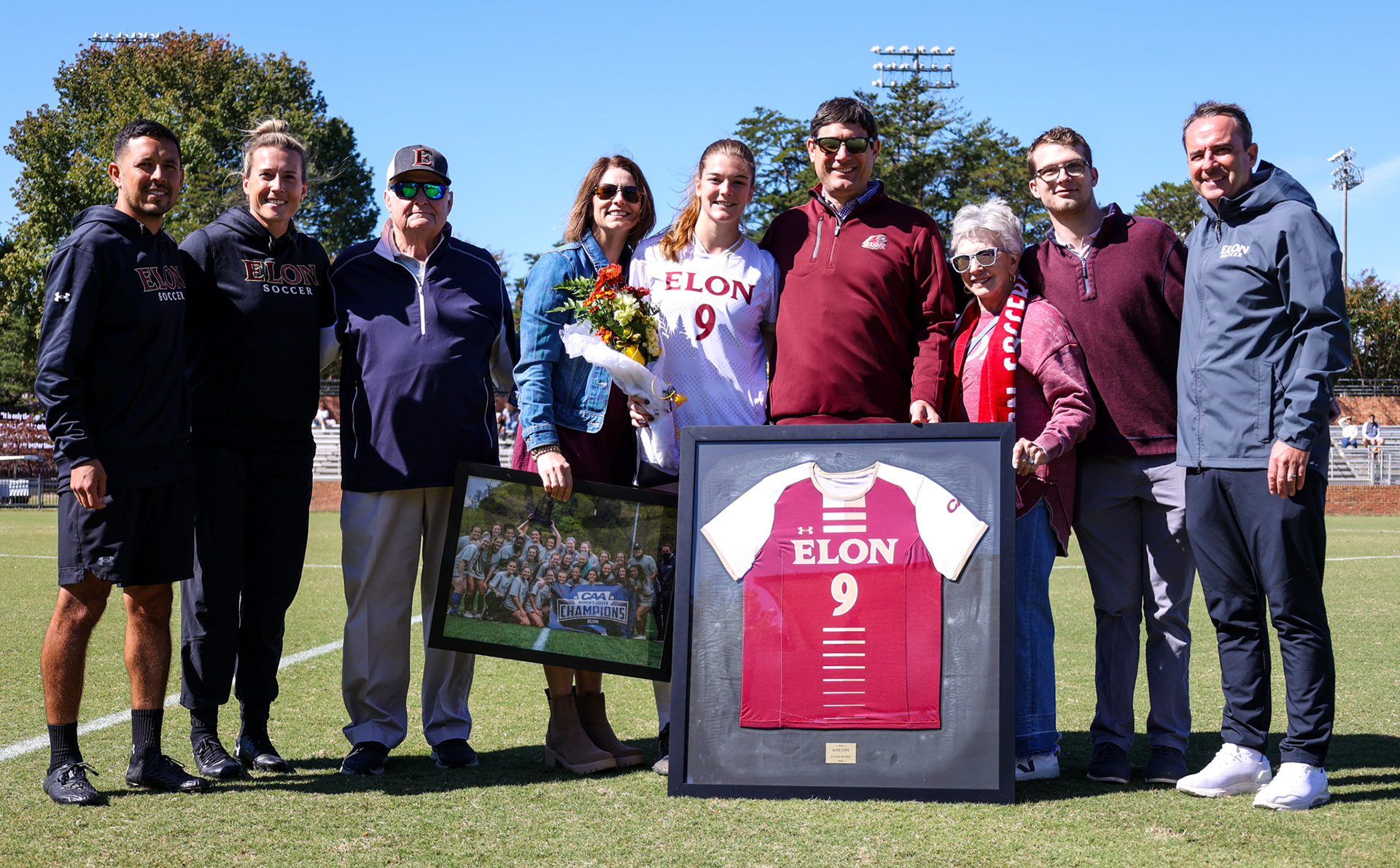 Senior Katie Lowe poses for a picture with her family during Elon’s Senior Day ceremony at Rudd Field on Oct. 8, 2023. Photo by Jacob Kisamore.