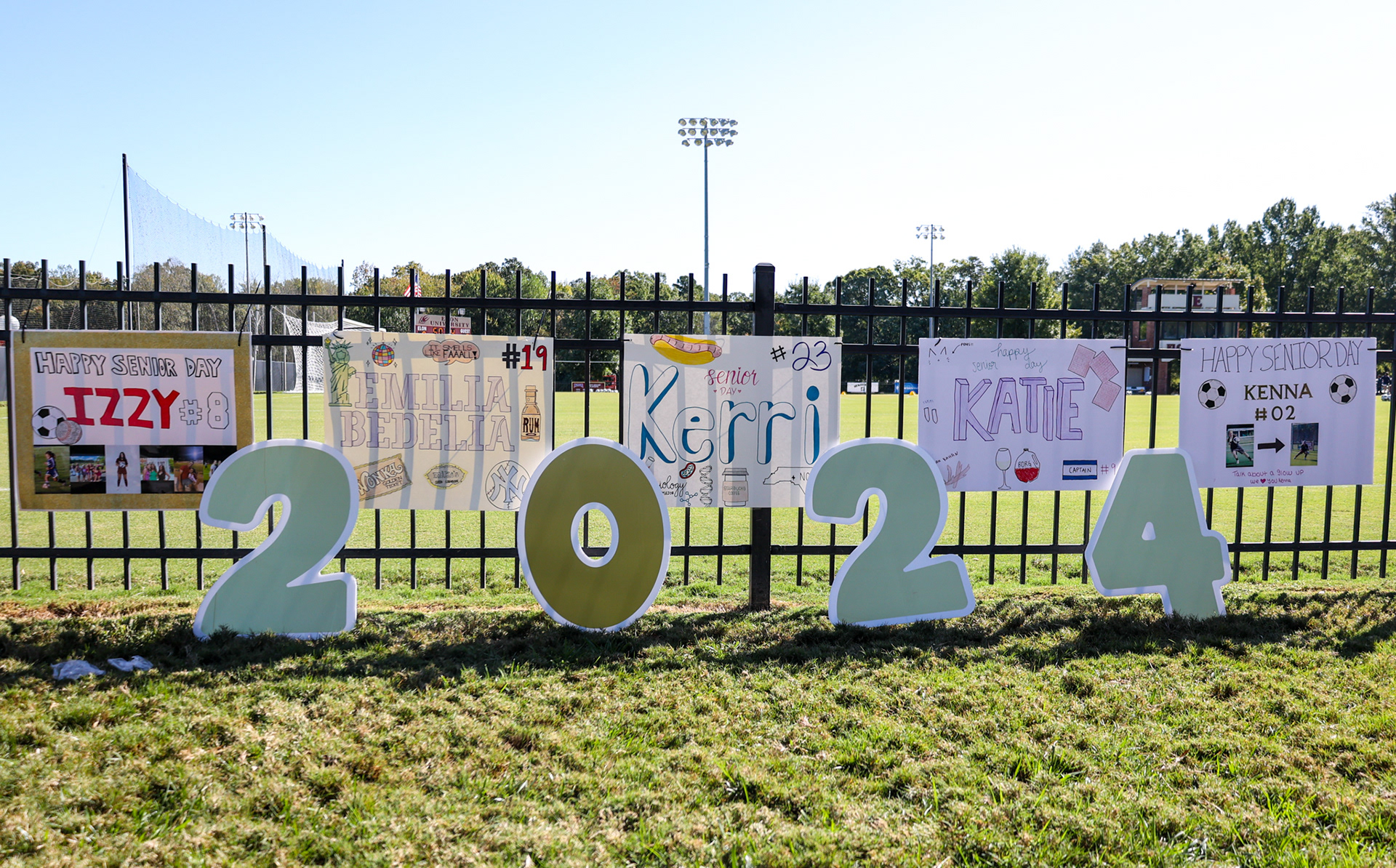 Senior posters on display at Rudd Field for all five Elon seniors on Senior Day on Oct. 8, 2023. Photo by Jacob Kisamore.