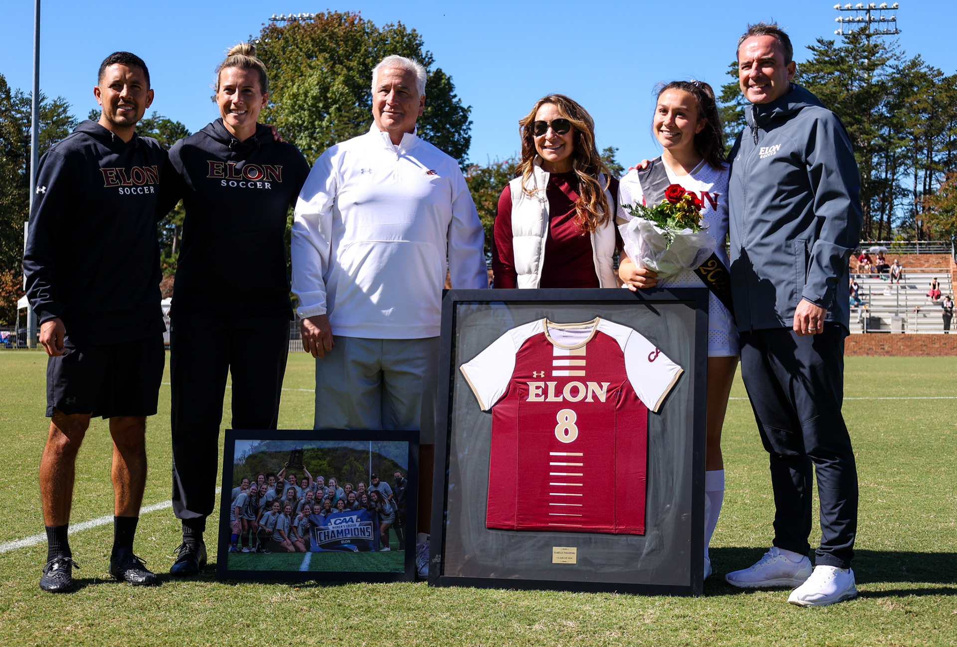Isabelle Paradoski poses for a picture with her family during Elon’s Senior Day ceremony on Oct. 8, 2023 at Rudd Field. Photo by Jacob Kisamore.