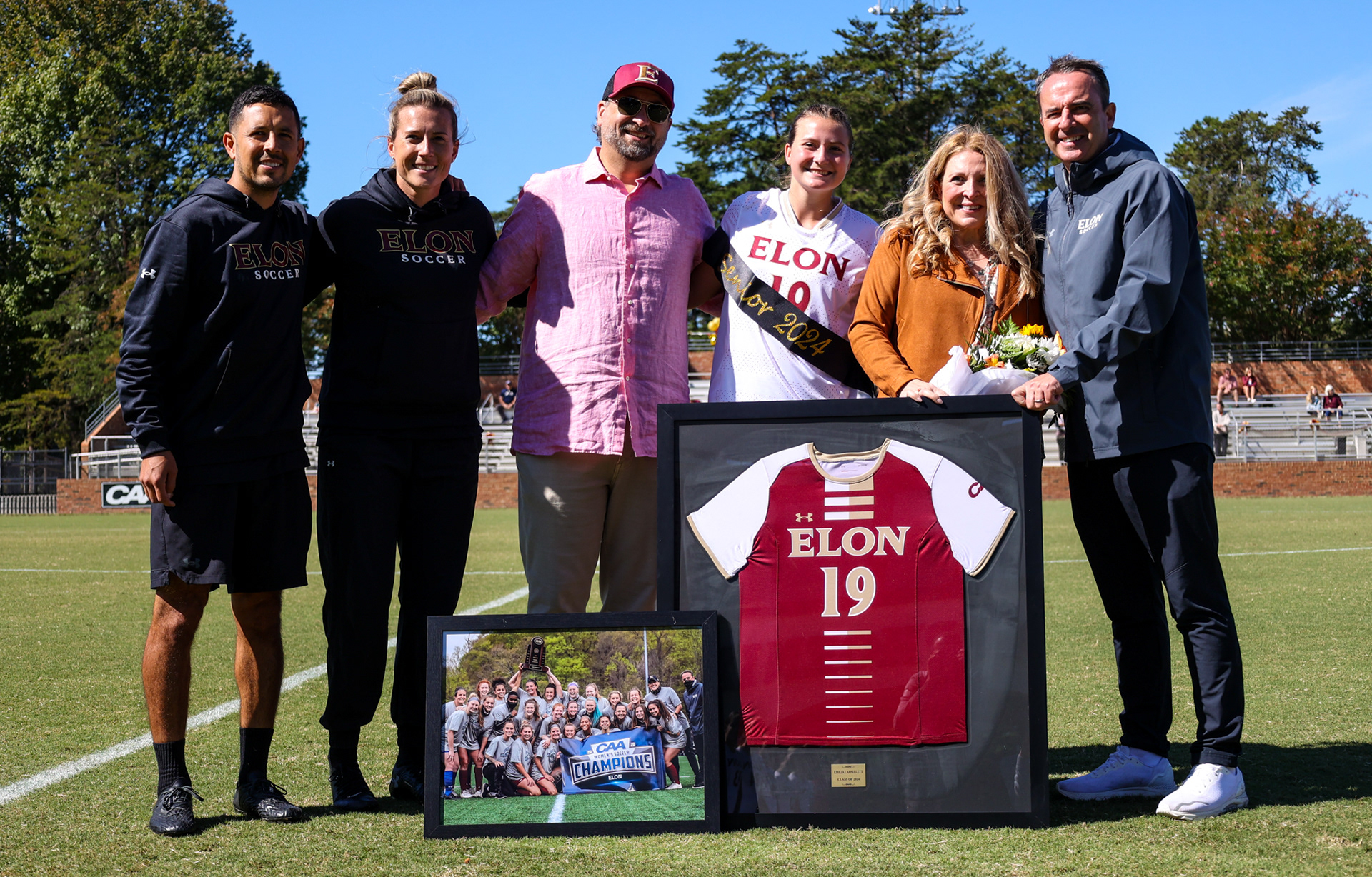 Senior Emilia Cappellett poses for a photo with her family during Elon’s Senior Day ceremony at Rudd Field on Oct. 8, 2023. Photo by Jacob Kisamore.
