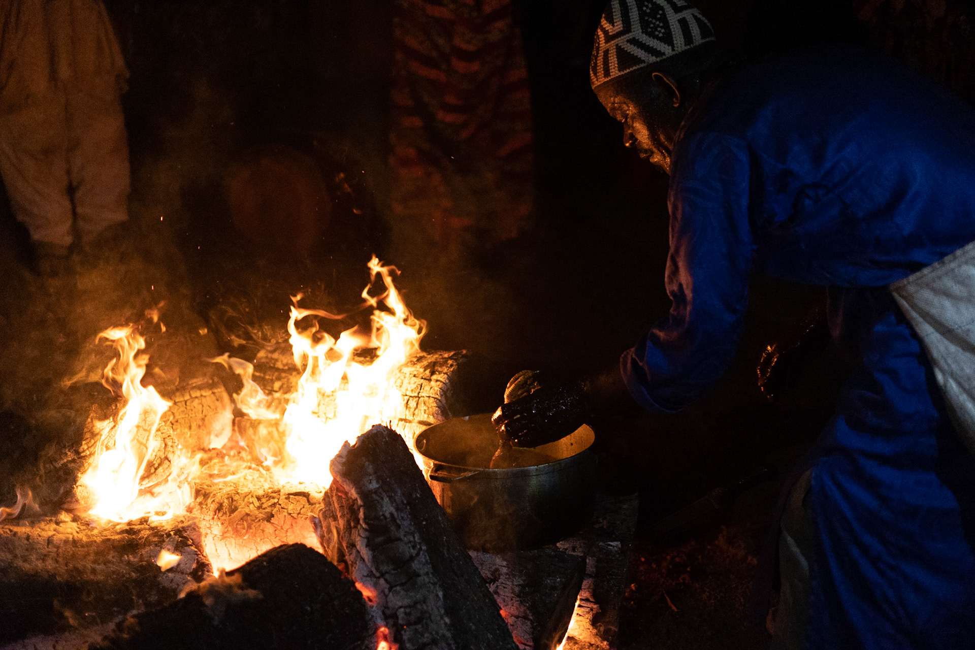Elder at the Kana Cultural Ceremony cooking bare hands with boiling oil, Cameroon 2022