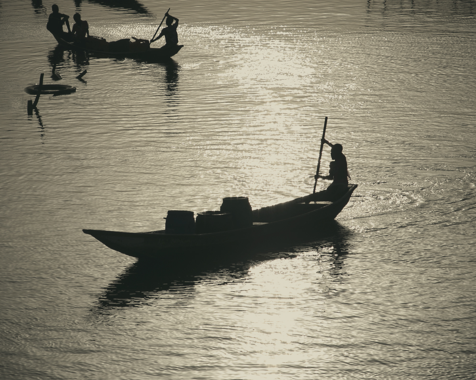 The setting sun illuminates the canoes of Ganvié - Benin 2018
