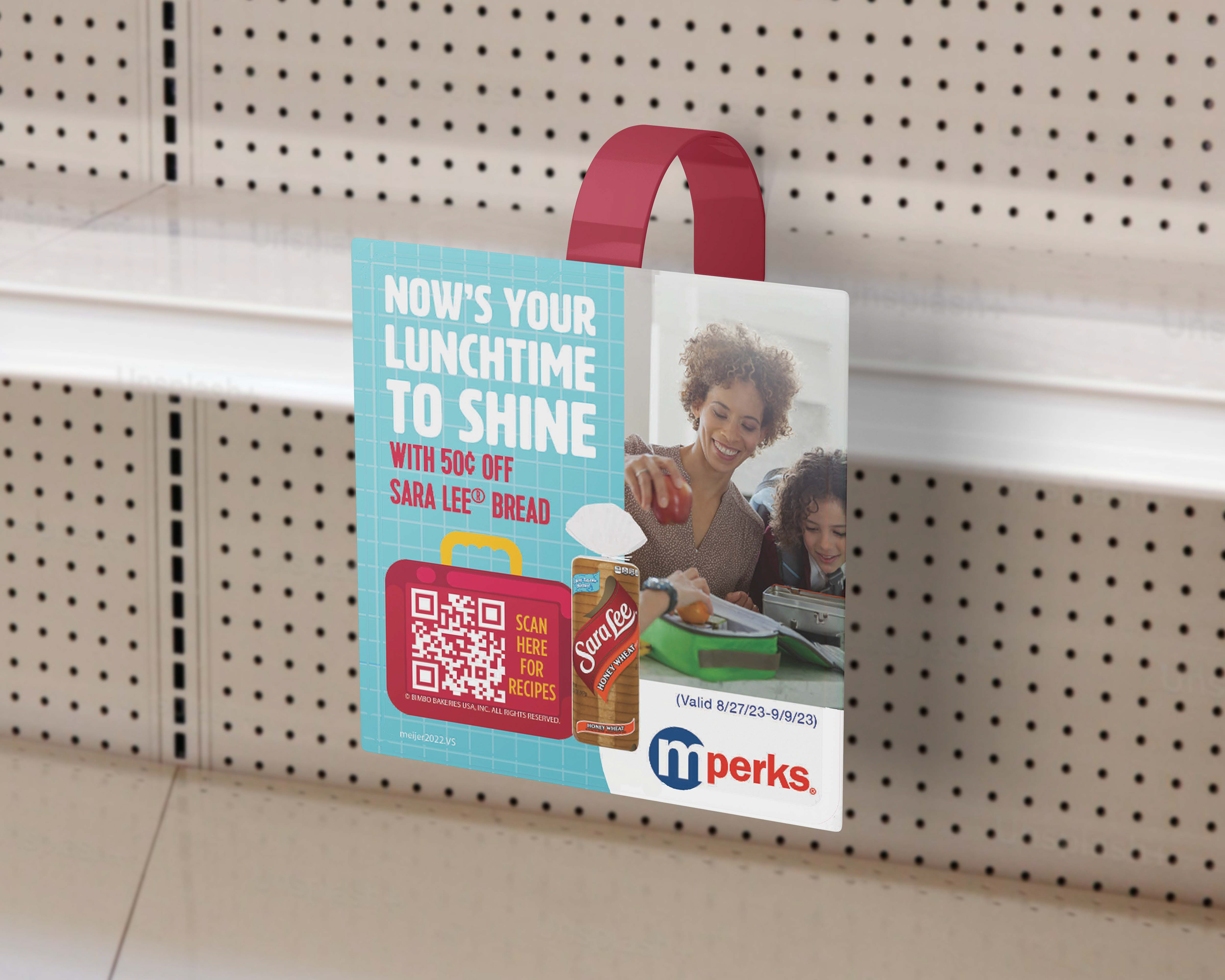 A shelf wobbler at Mejiers with a Sara Lee coupon.