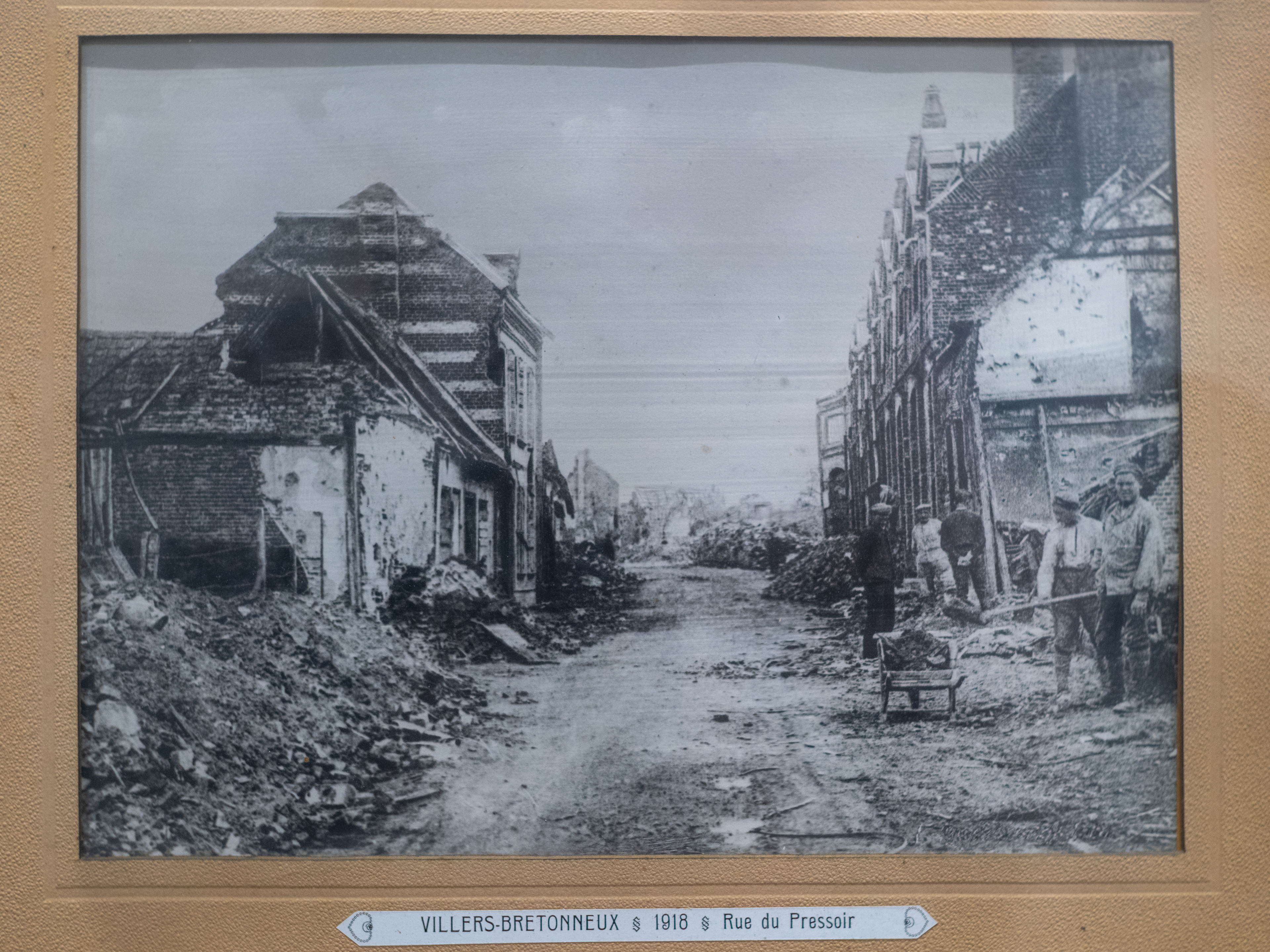 Archival photograph of Rue du Pressoir, Villers-Bretonneux, 1918, showing the destruction of the town following the battles prior to and including  April 1918. Photographed in situ, Franco-Australie museum, Villers-Bretonneux, 2026. Photo: Jon L Arthur