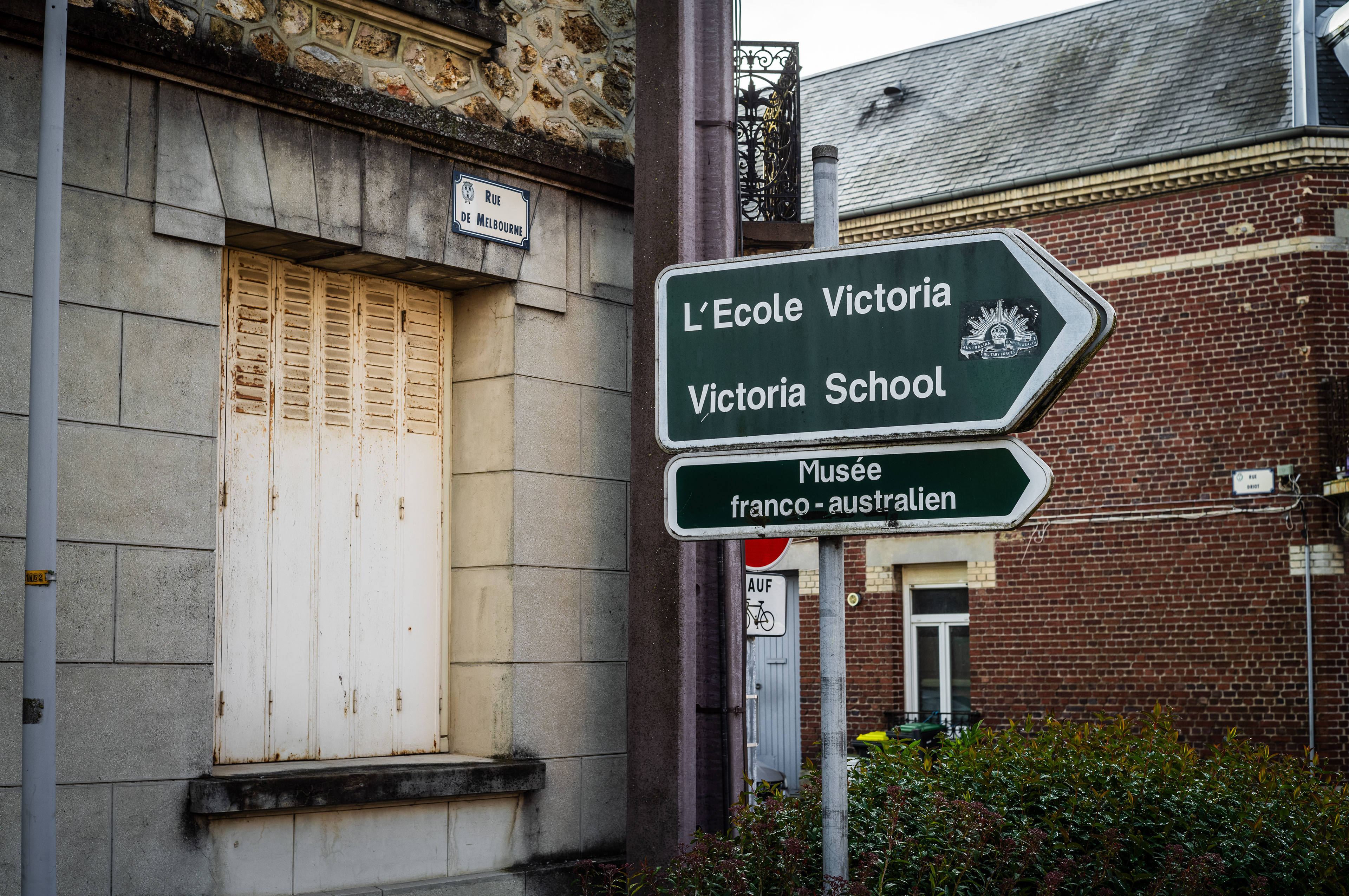 Street signs at the intersection of Rue de Melbourne, Villers-Bretonneux, France, May, 2026, pointing toward Victoria School and the Franco-Australian Museum. Many streets have been renamed using Australian town names. Photo: Jon L Arthur