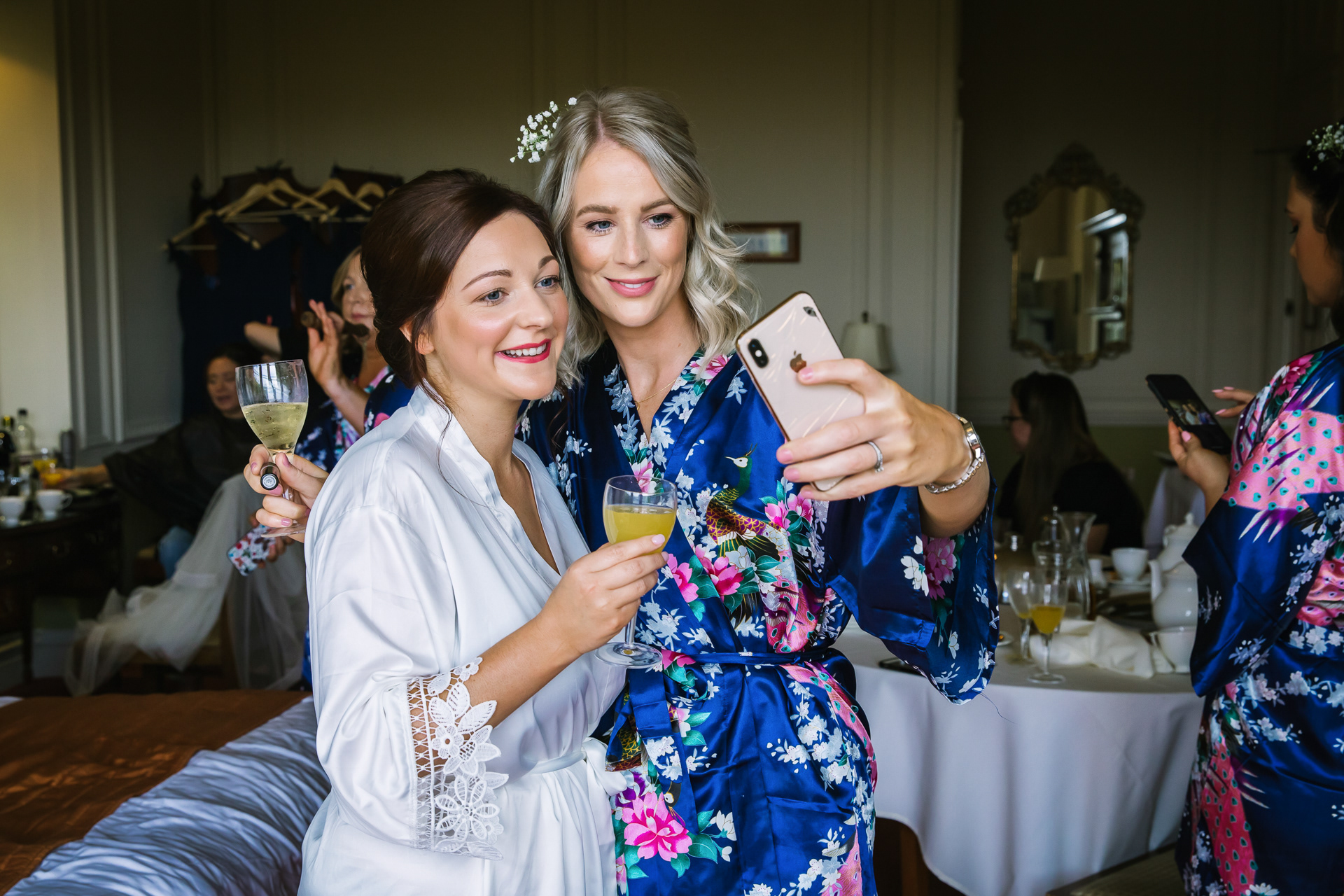 Bride and bridesmaids taking a picture