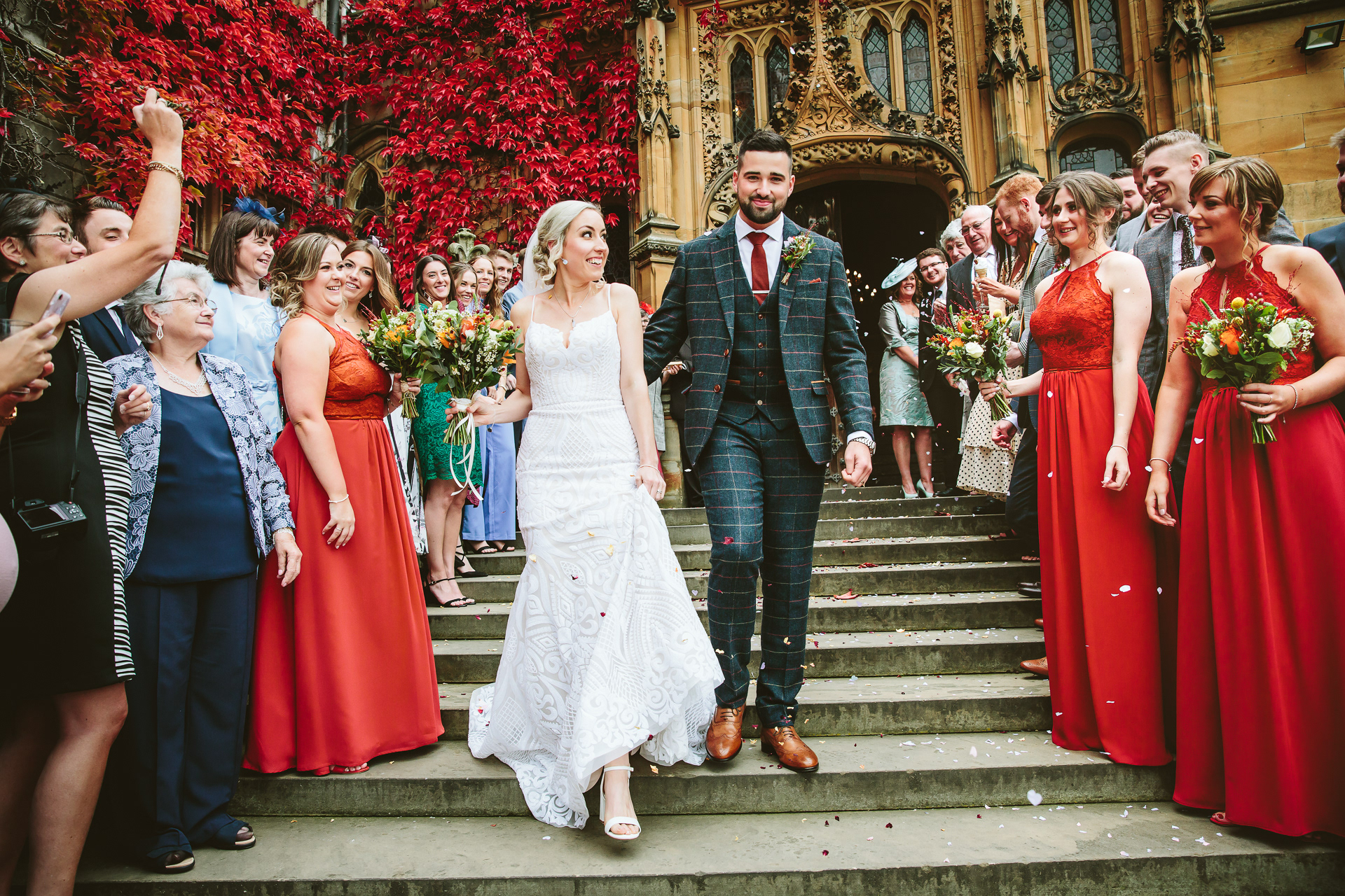 Bride and groom with confetti at their wedding at Carlton Towers in Yorkshire, England
