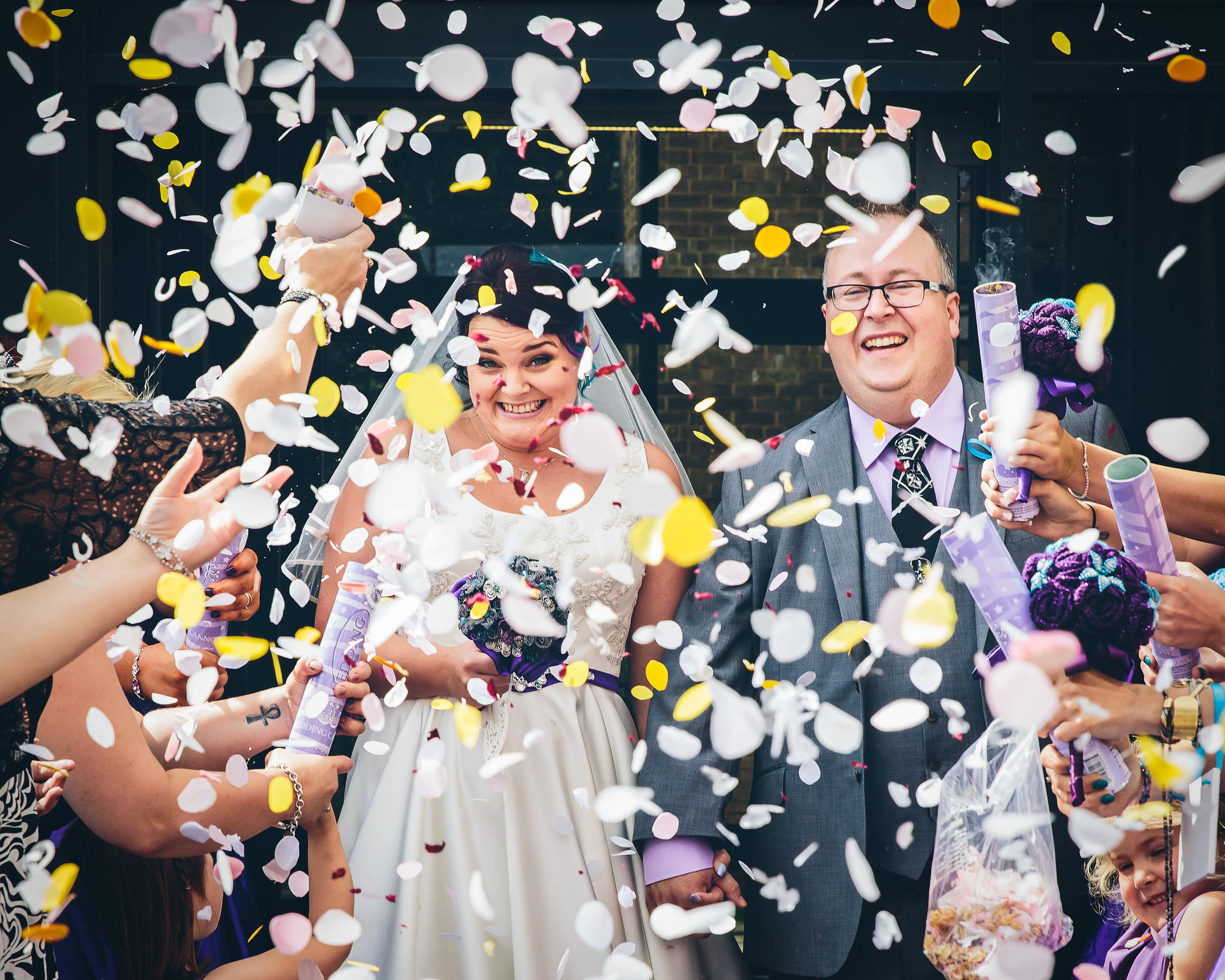 Bride and Groom with confetti at a wedding in Lincolnshire