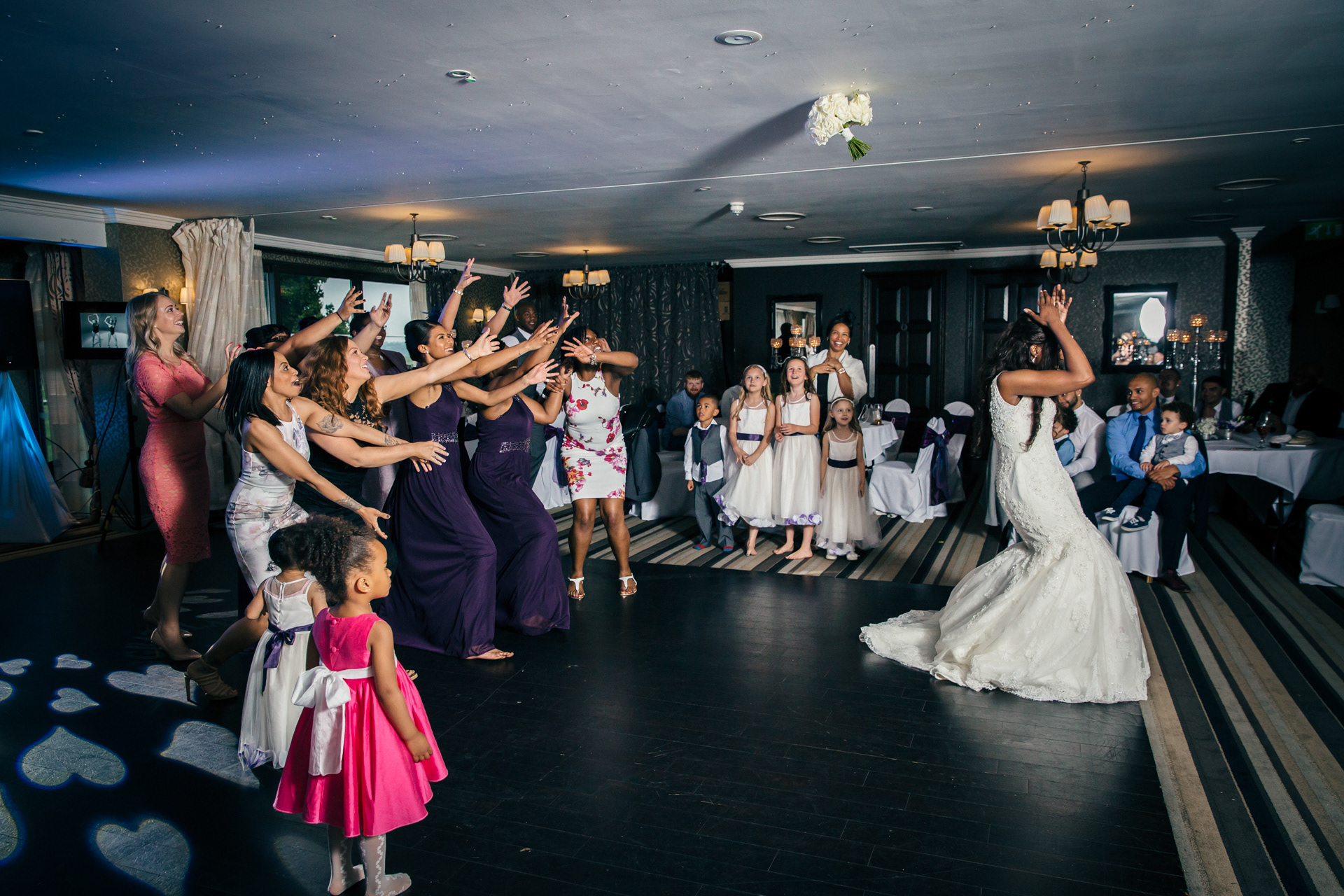Bride throws bouquet at a wedding at The Nottinghamshire Golf Club