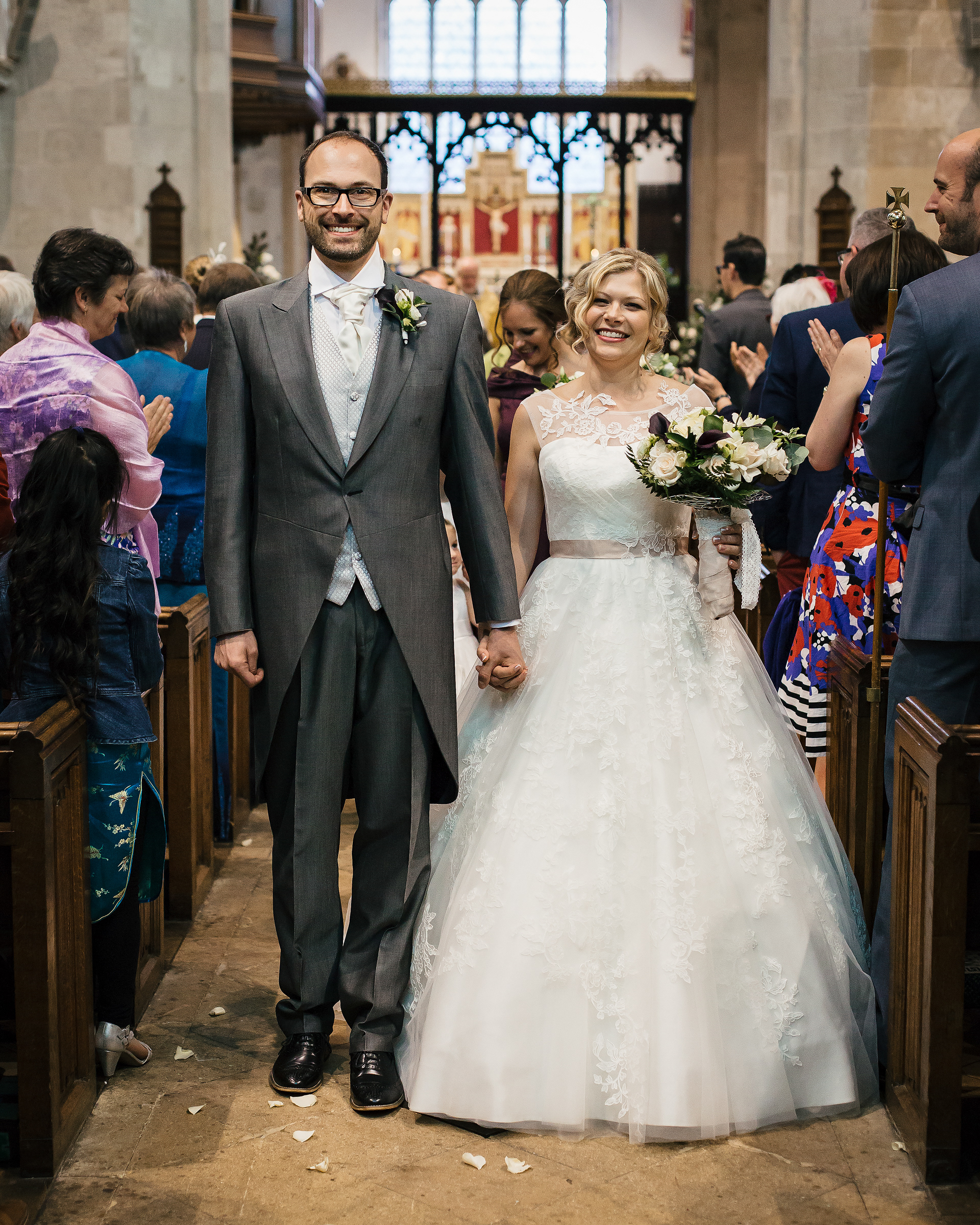 Bride and Groom walking down the aisle