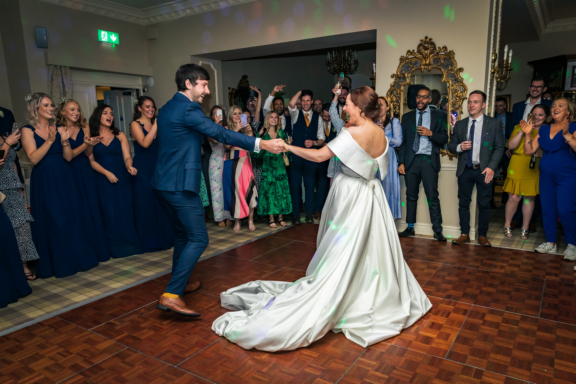 A bride and groom dancing at their wedding at Merewood Country House Hotel, Cumbria