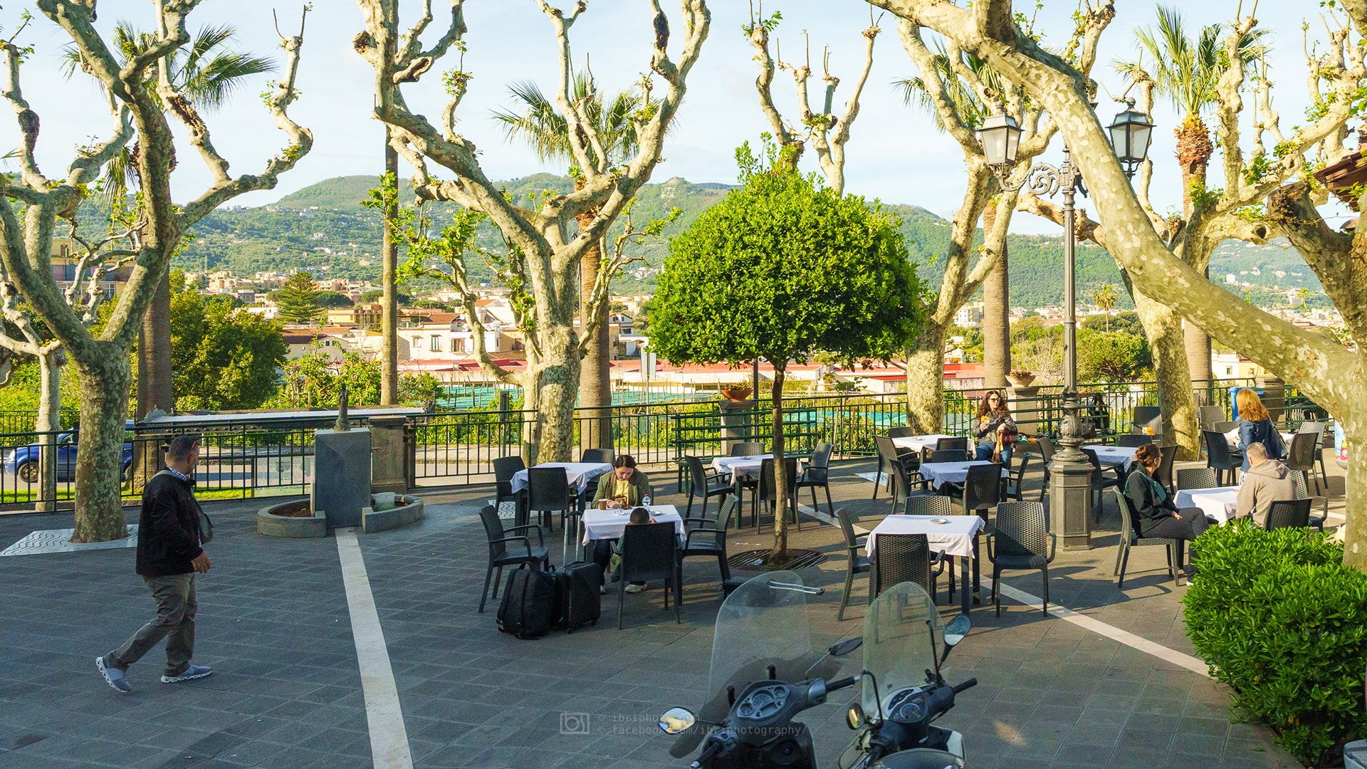 Roadside cafes starting to fill with morning commuters and tourists