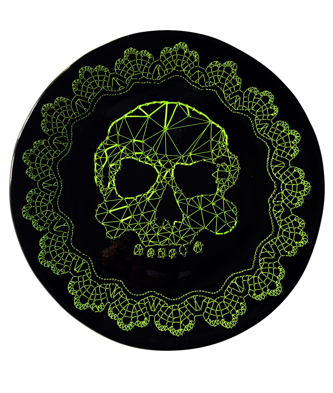 Eat your ego, (second part) is an embroidered ceramic plate. the embroidery is on the edge of the plate is a lace (embroidered) and in the center a skull (embroidered), the embroidery is made with fluorescent nylon and rayon threads, which represents the main menu: "your ego" and how it goes Stay your ego after you have eaten. "Your ego" is always on the plate, served for you to eat it. This is a collaboration with the ceramist Miguel Vazquez.